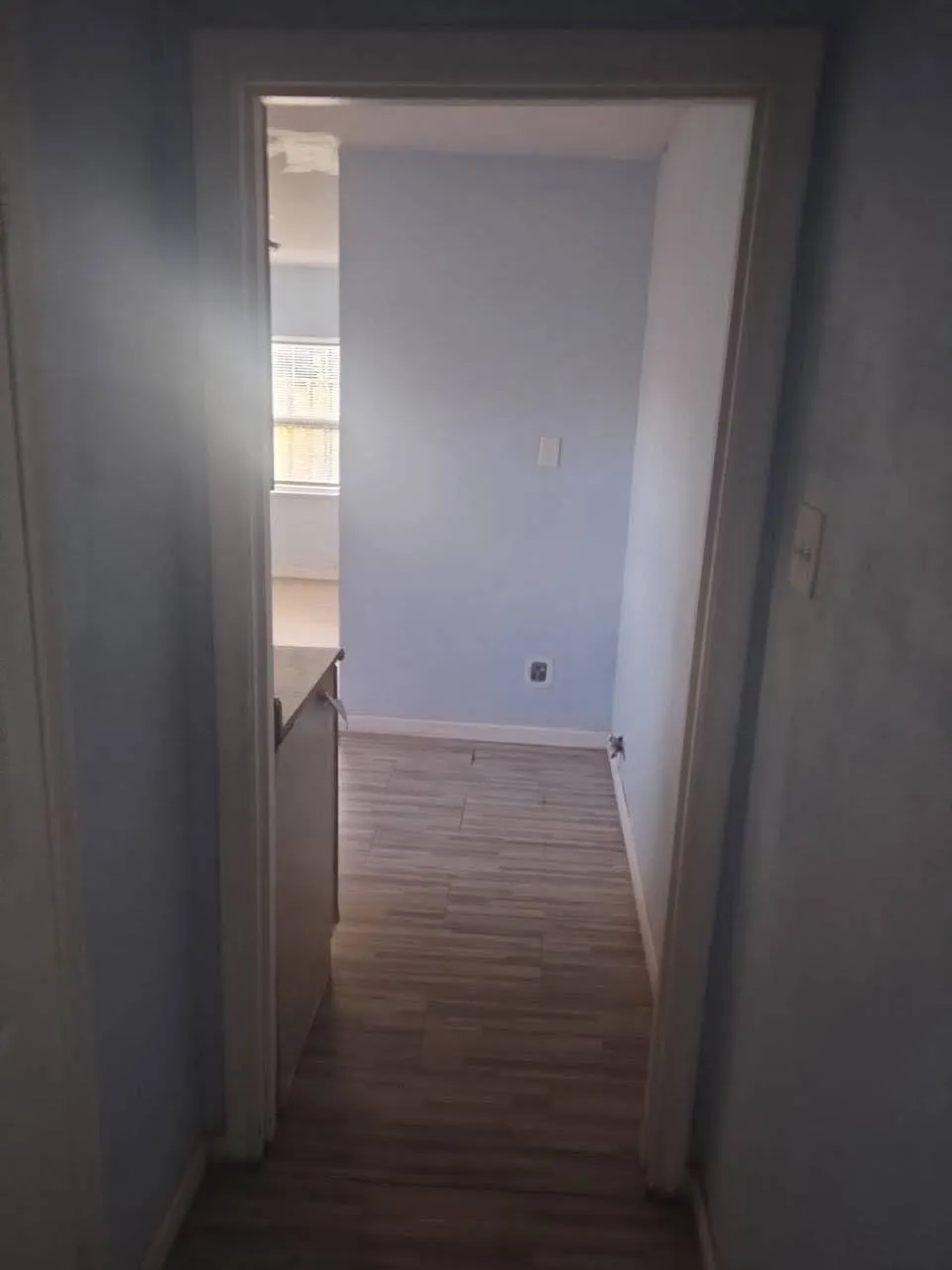 Corridor with baseboards and dark wood finished floors