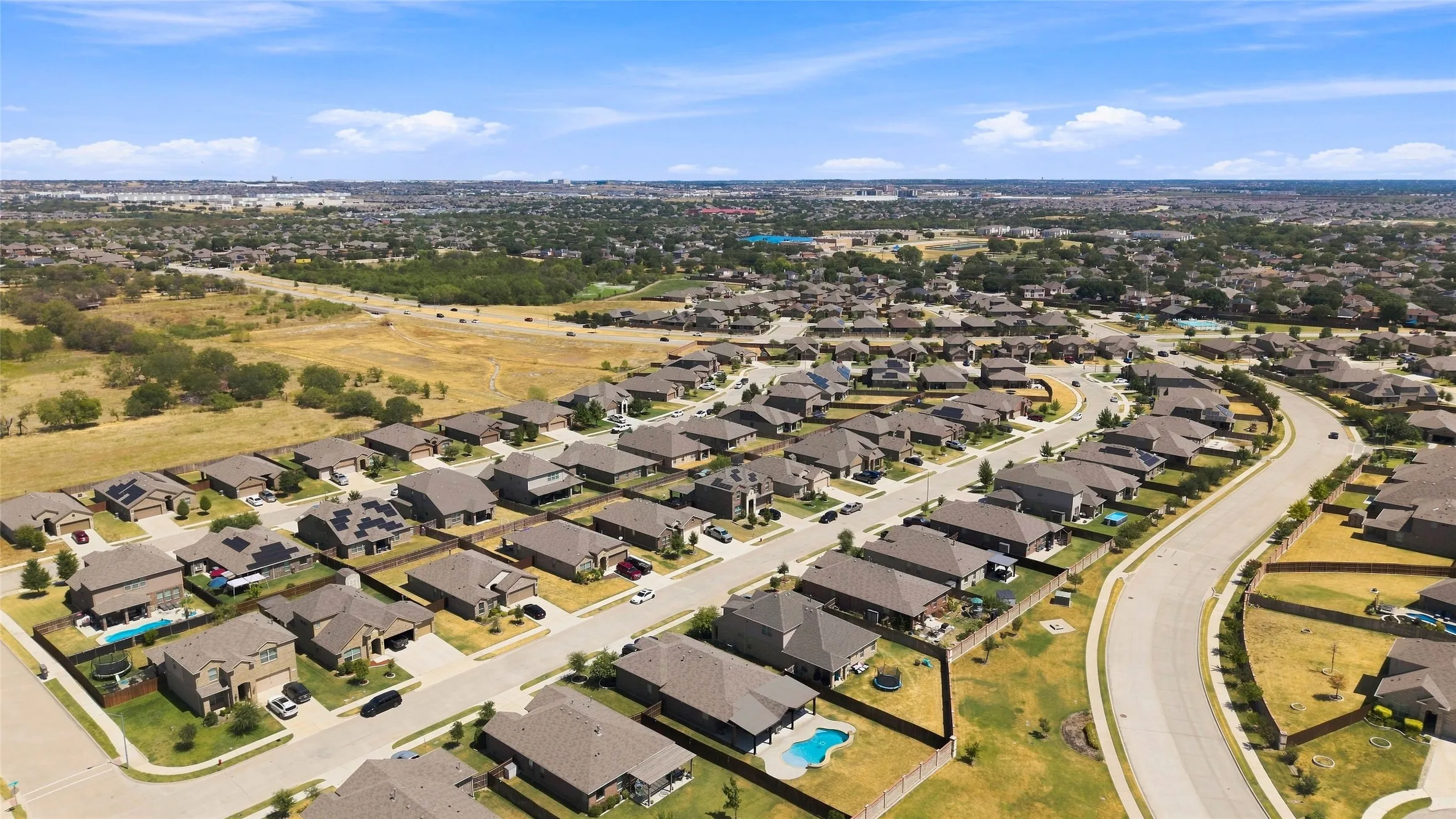 Suburban neighborhood with established residences and a pool
