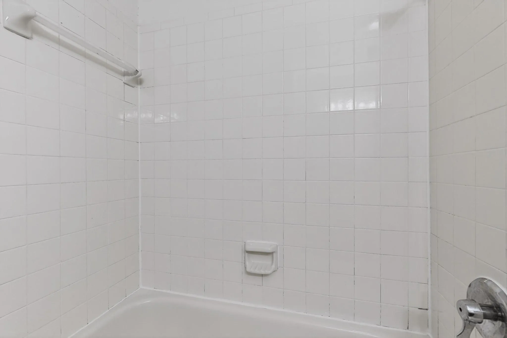 Bathroom featuring washtub / shower combination