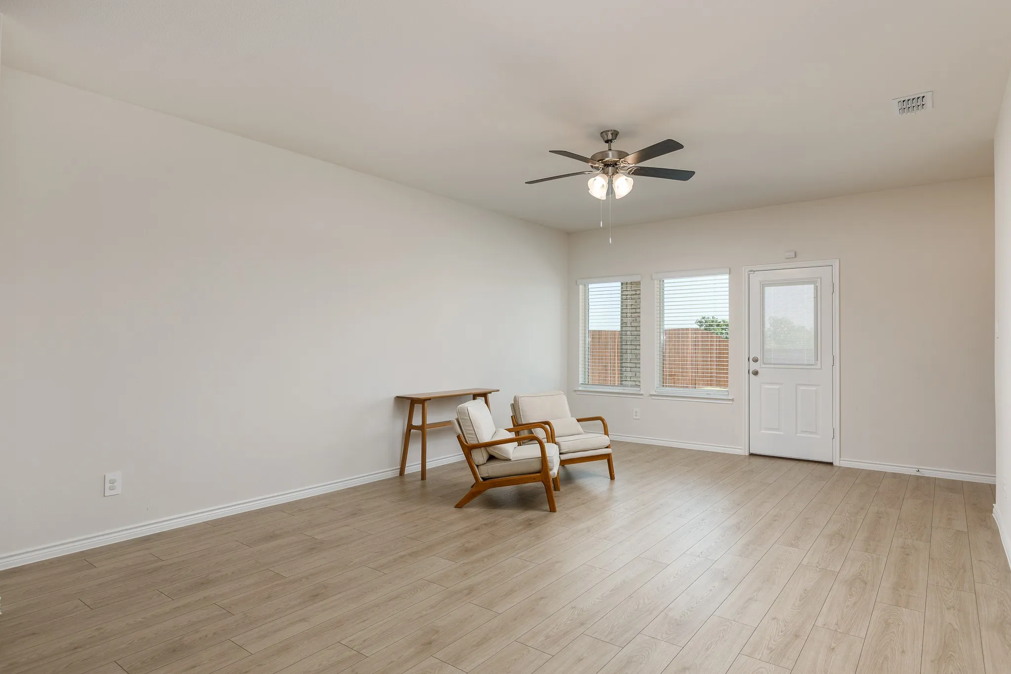 Light wood-finish flooring with neutral wall tones