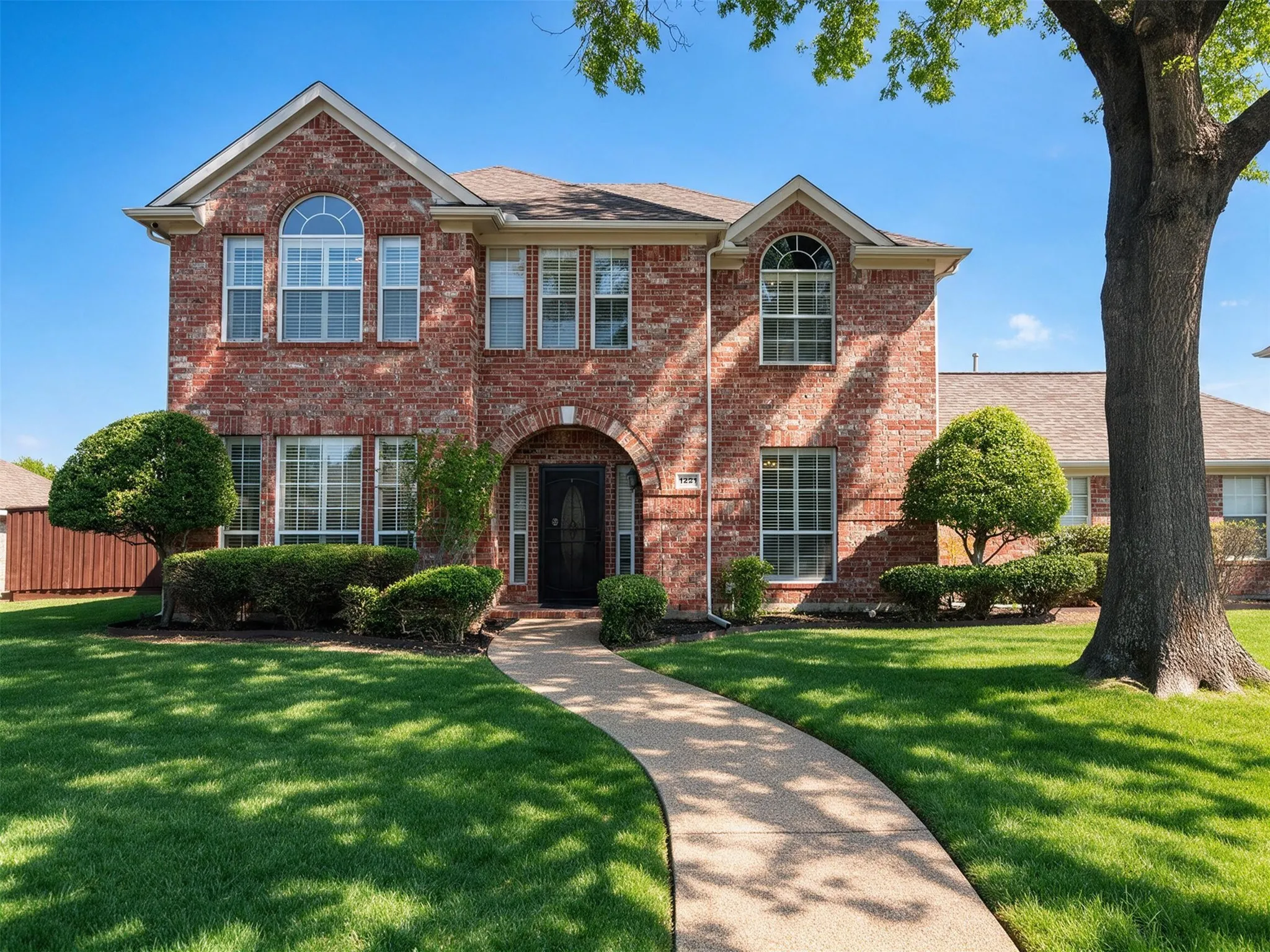 Brick exterior with arched entry