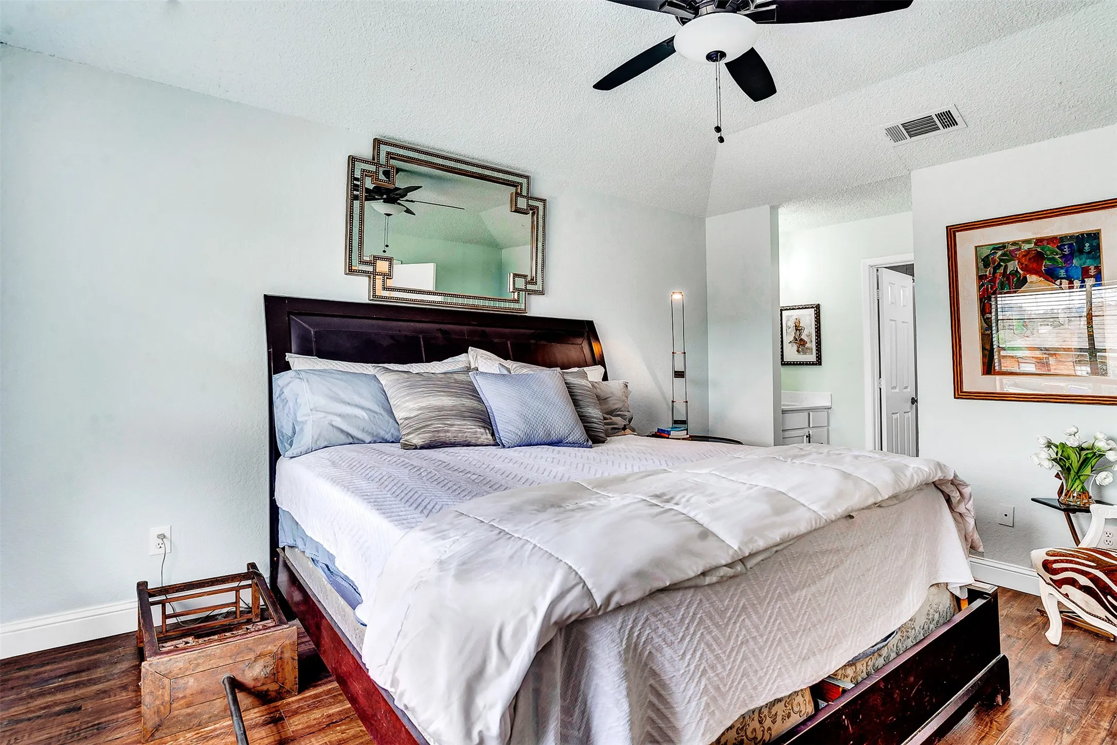 Wood-finish flooring, ceiling fan, vaulted ceiling, and recessed lighting