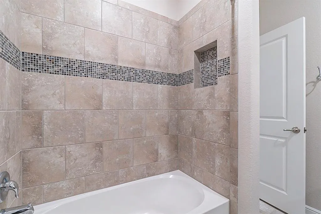 Bathroom with shower / bathing tub combination