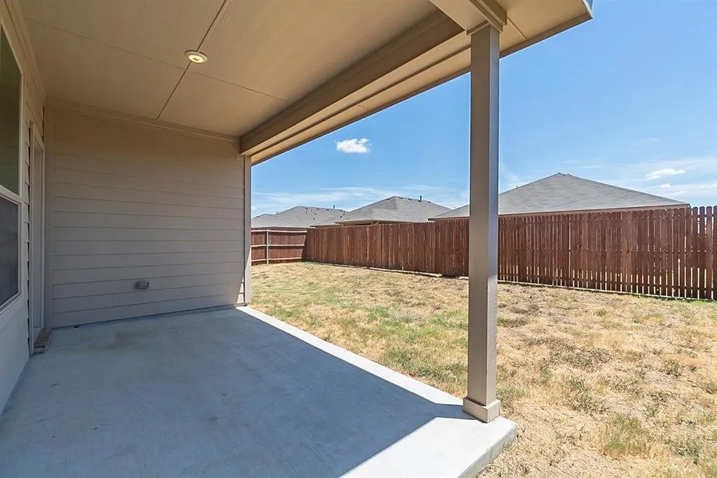 View of yard with a patio and a fenced backyard