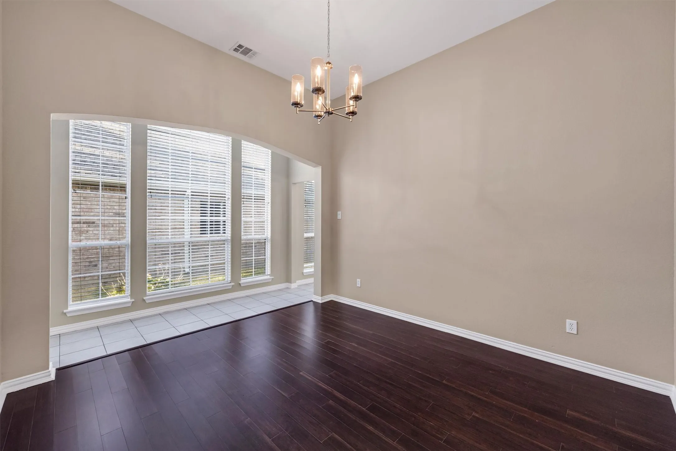 Formal Dining room opens to living room. large windows on walk thru to kitchen
