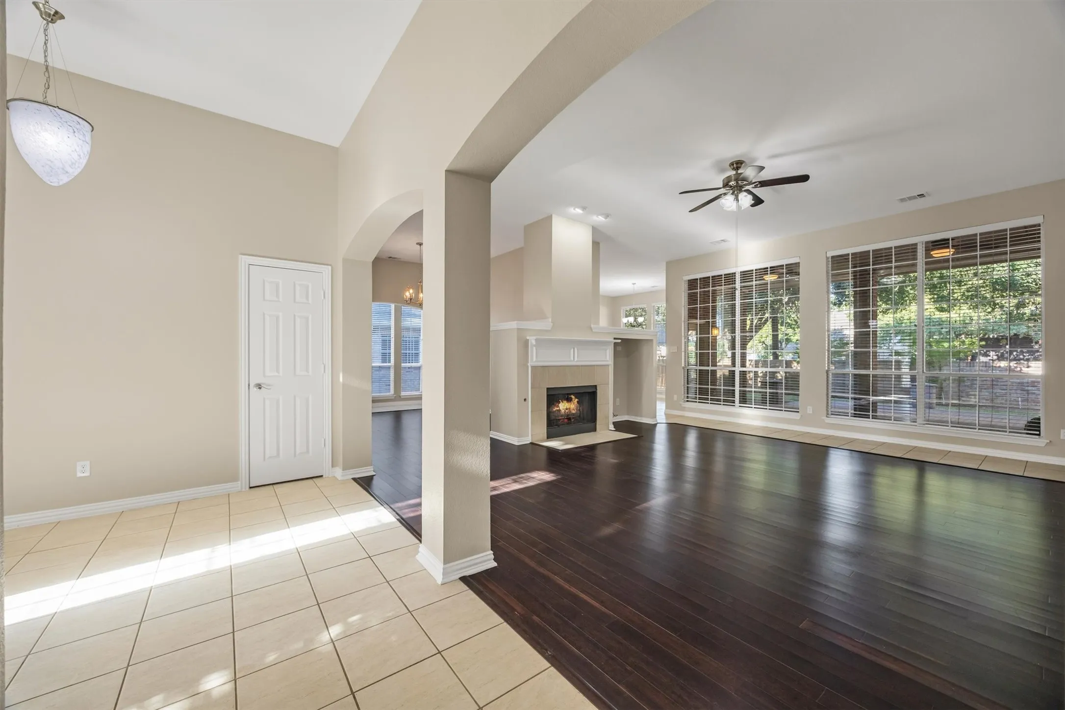 Vaulted ceilings, bamboo flooring, center fireplace, extensive windows with natural lighting