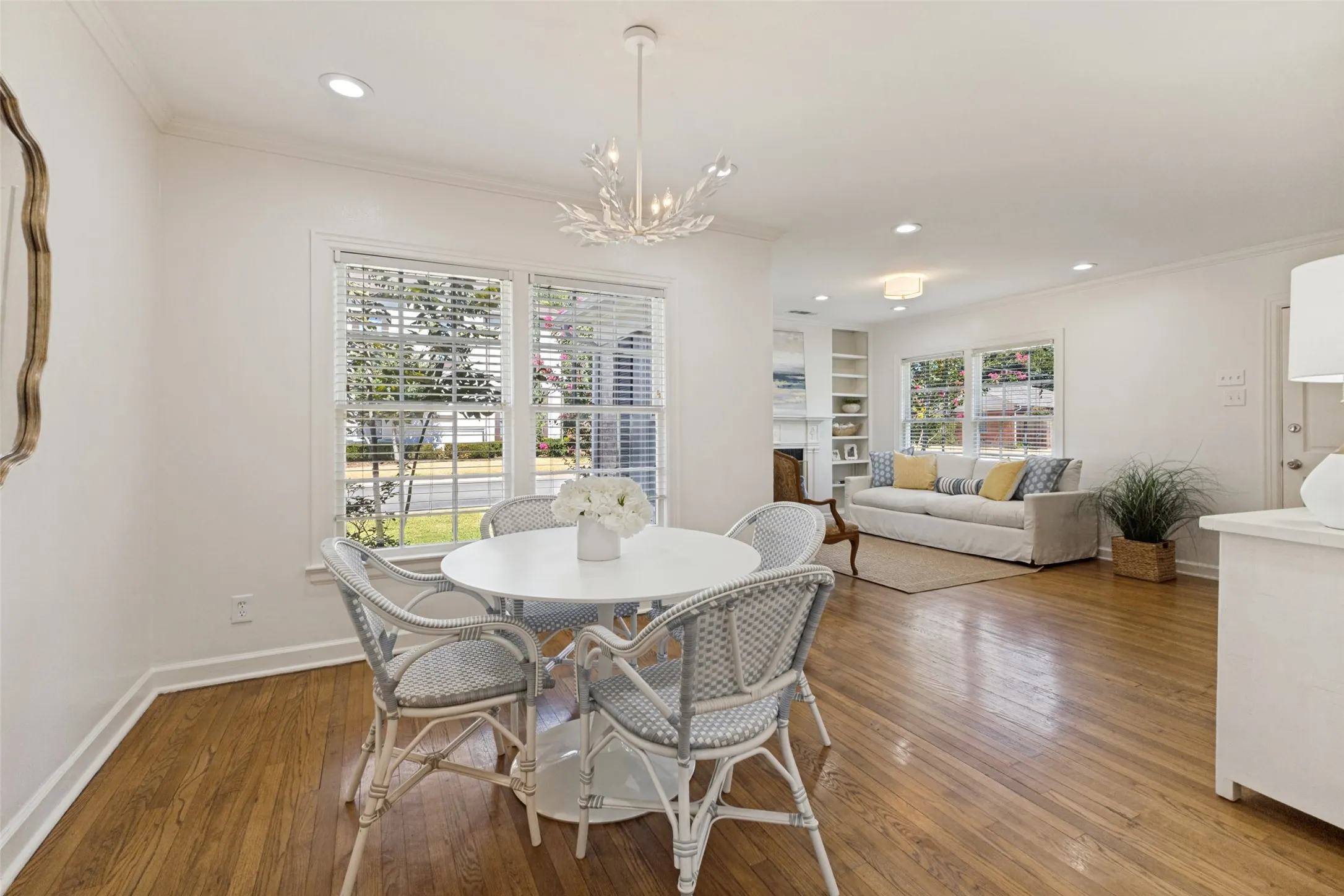 The open dining room provides space for larger gatherings if one desires. Shown with a buffet to the right.