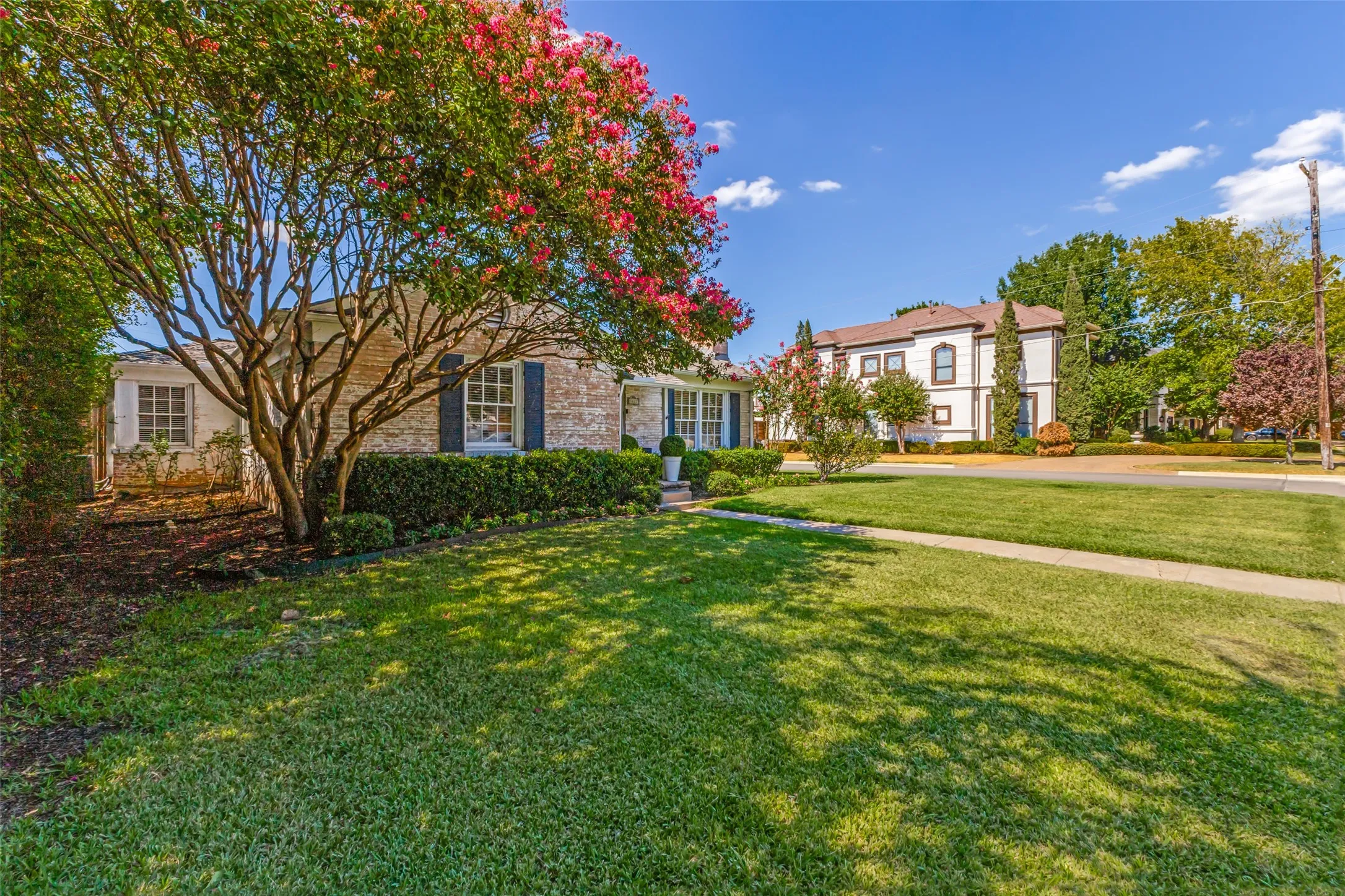 Valuable corner lot with side entry driveway and surrounded by newer construction, as well as single-level homes that have maintained their charm.