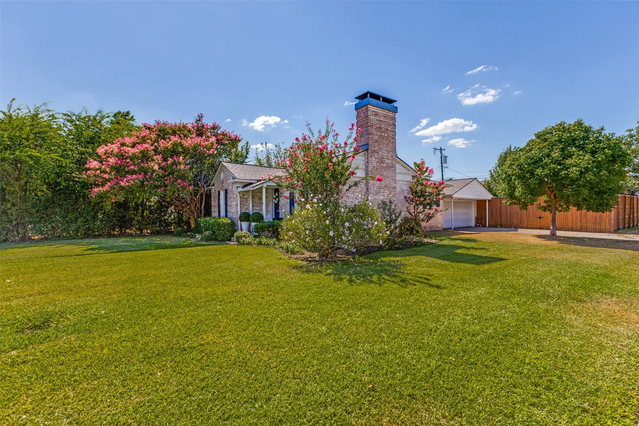 Set on a corner lot, the generously sized backyard is enclosed by a wood privacy fence and features a spacious deck—perfect for neighborhood gatherings, weekend barbecues and relaxed outdoor living.