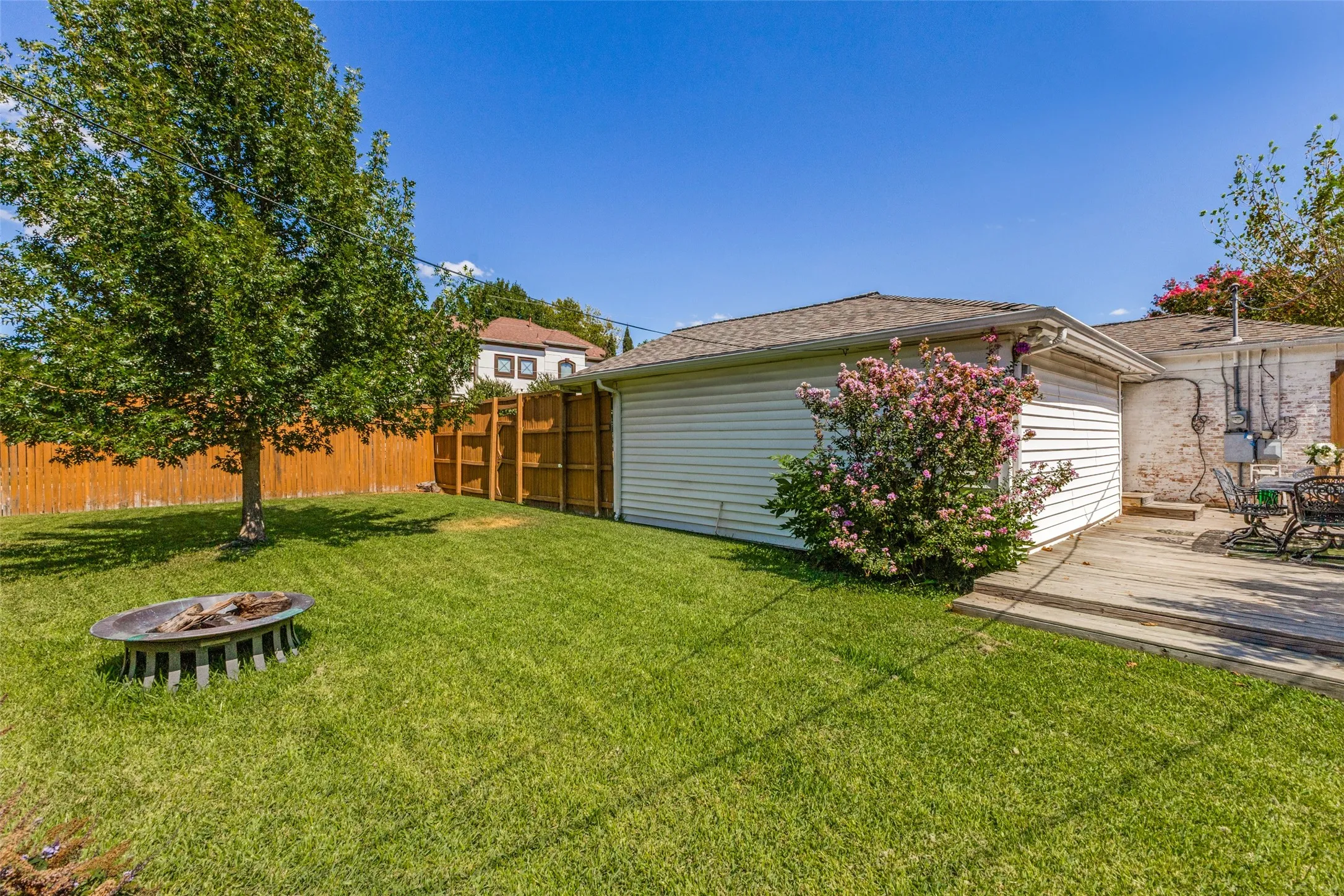 Gather around the fire pit this upcoming fall season with plenty of space on this corner lot.