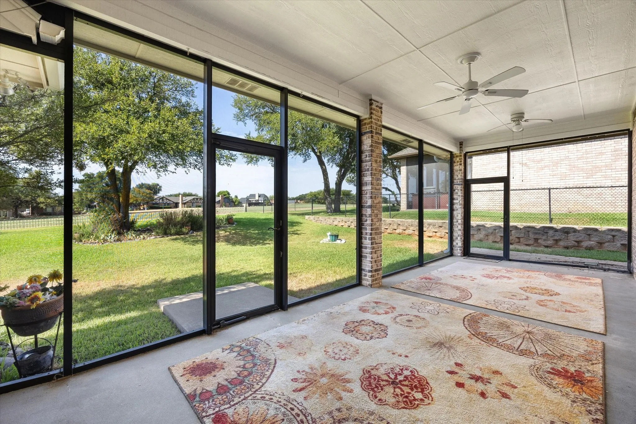 Enjoy quiet mornings and watch the golfers from this expansive screen in porch/patio area