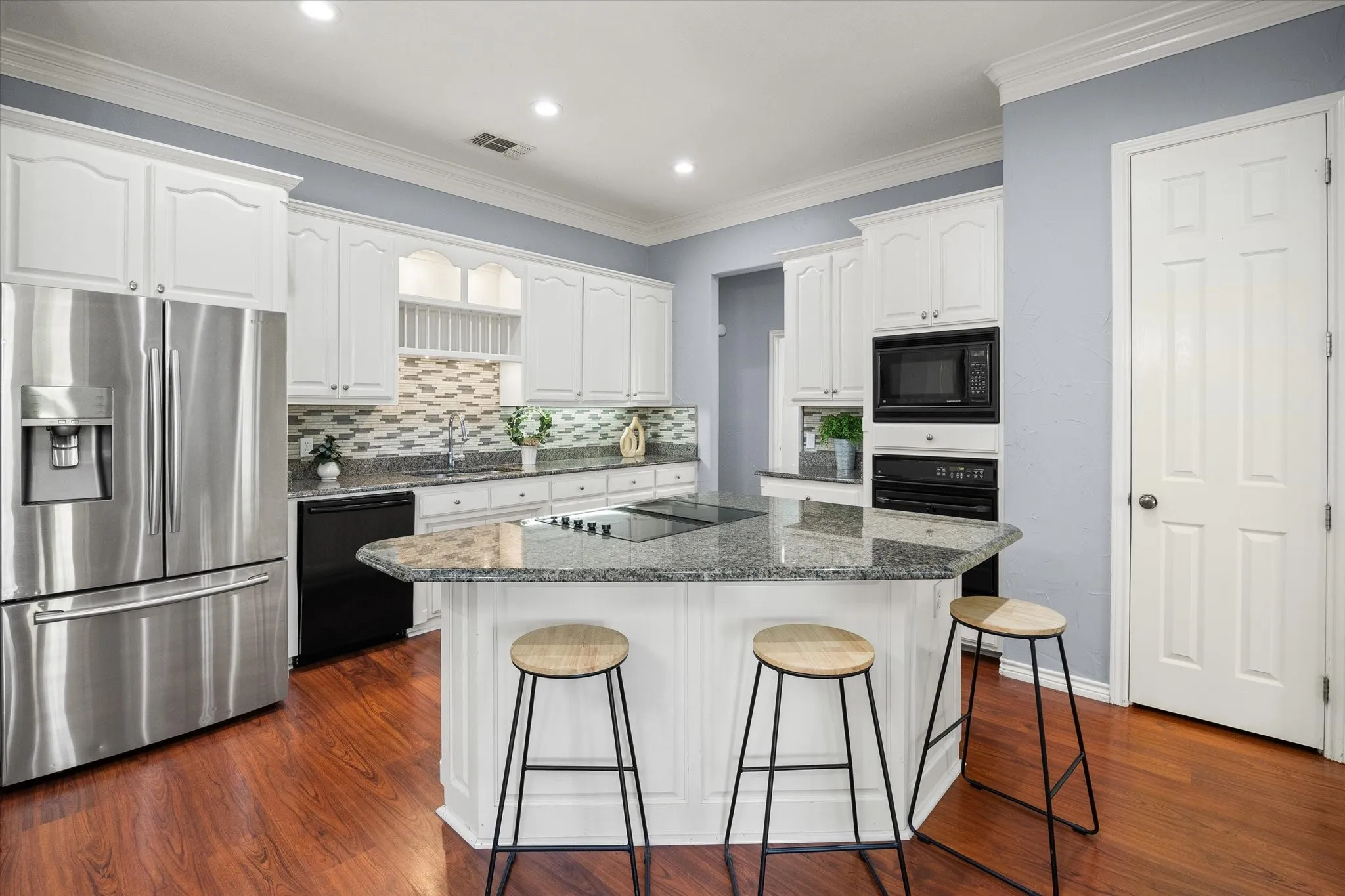 Generous island for prep with bar seating