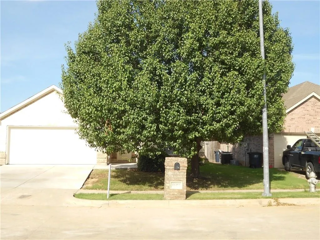 Brick mailbox with a prominent address plaque