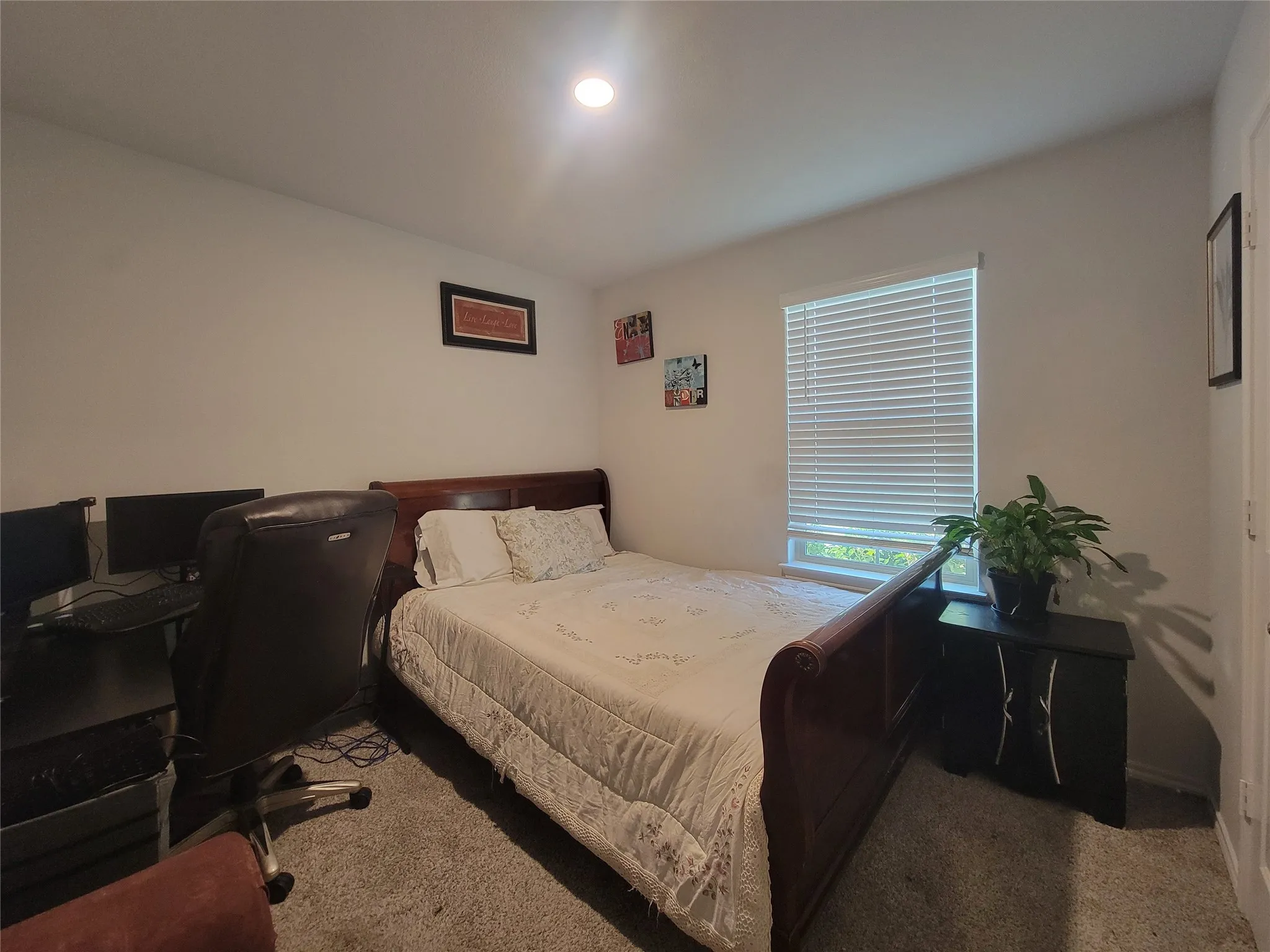 Recessed ceiling lighting, white walls, window with blinds, and carpeted flooring