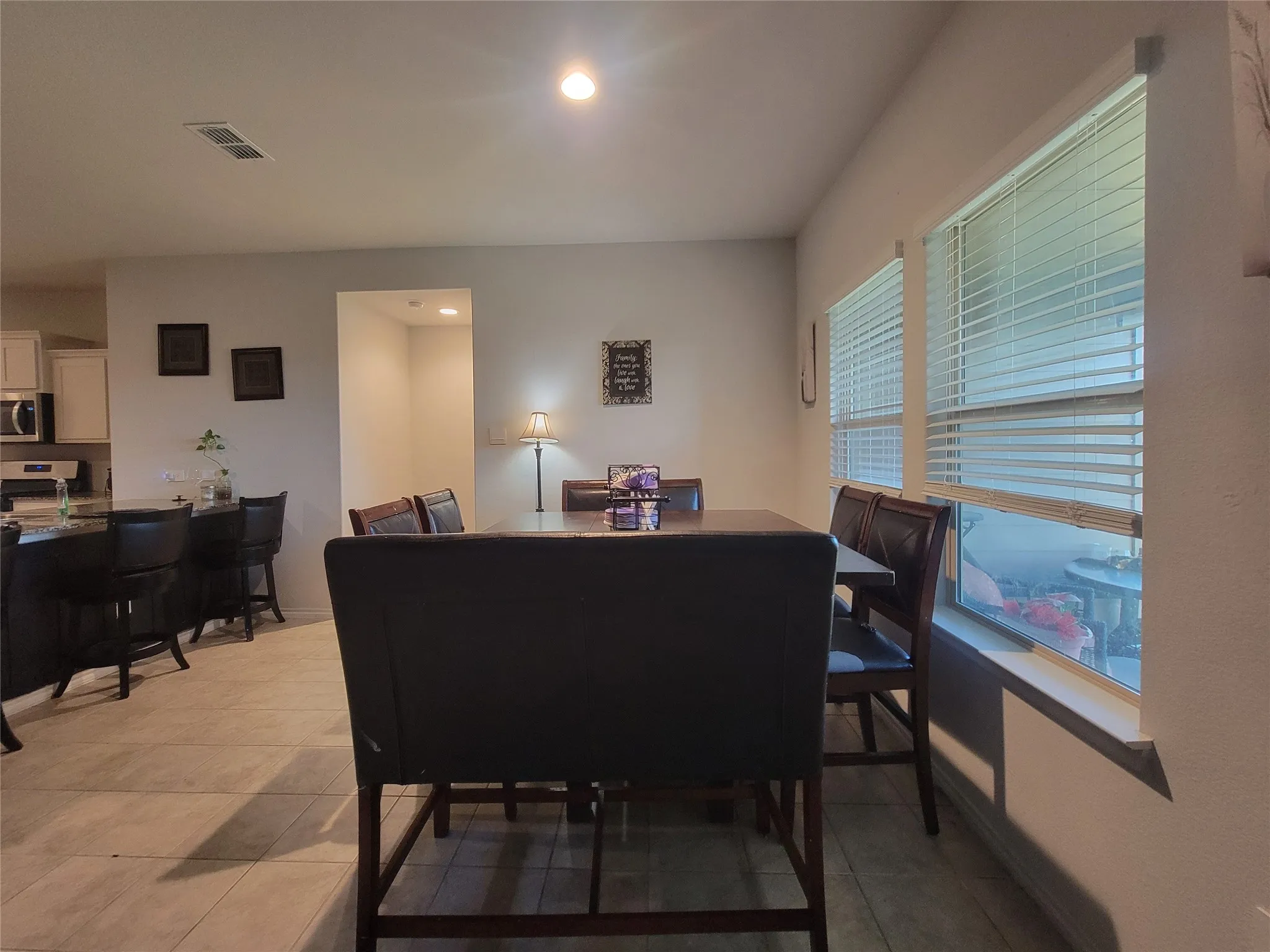 Tile flooring extending through dining area and kitchen