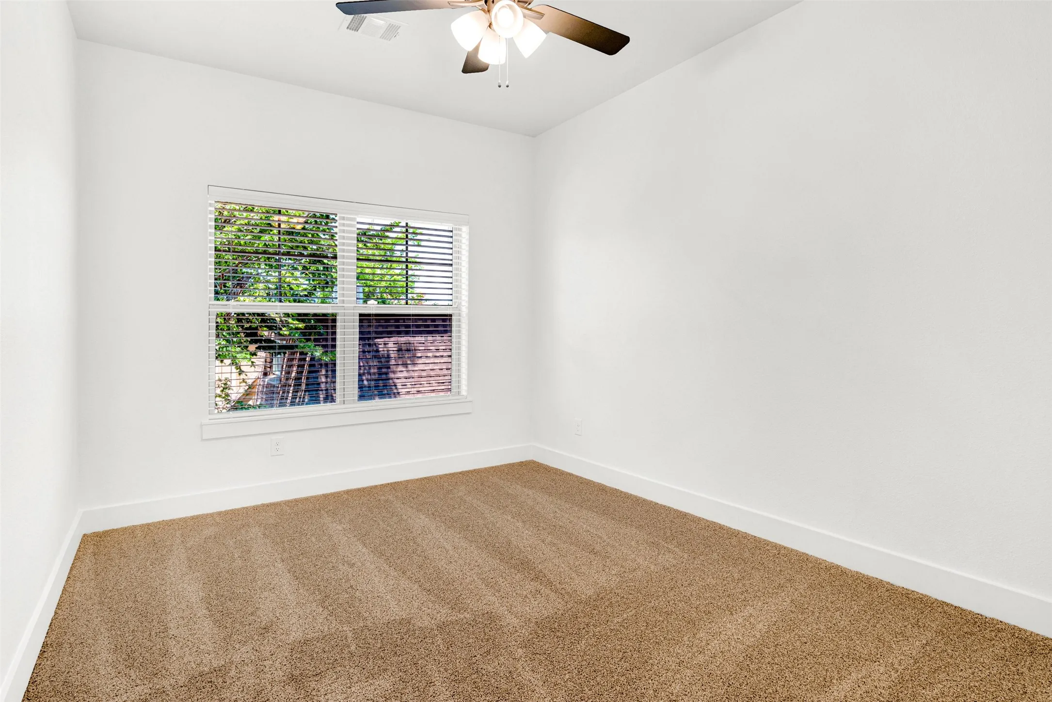 Spacious upstairs bedroom with ample natural light.
