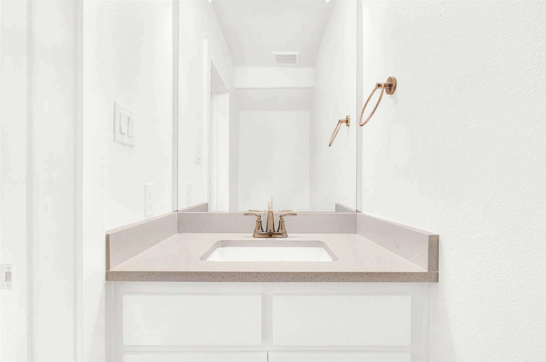 Downstairs custom half bath with above vanity.