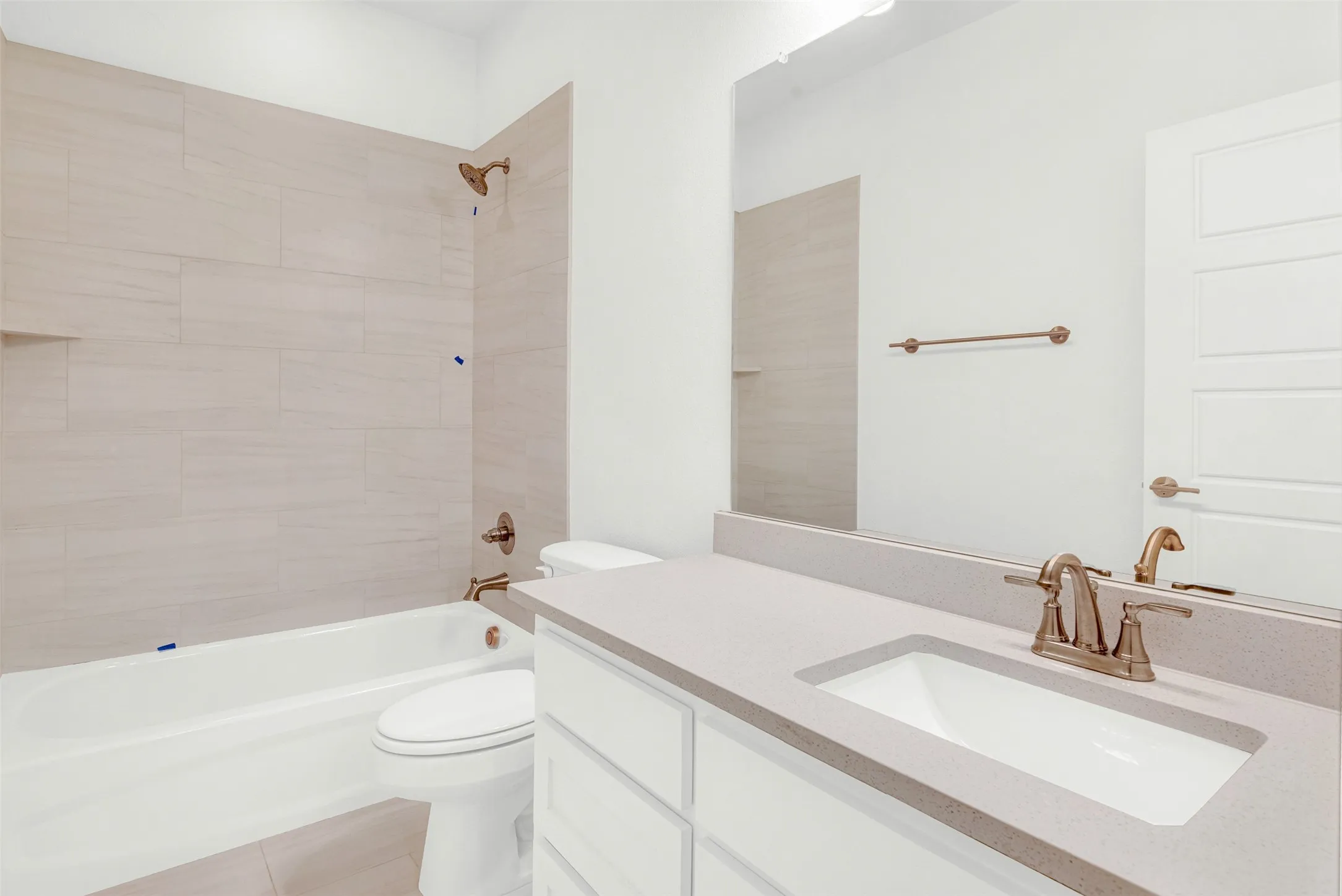 Second floor bathroom with shower and tub has 5' mirror over vanity to serve the other two upstairs bedrooms.