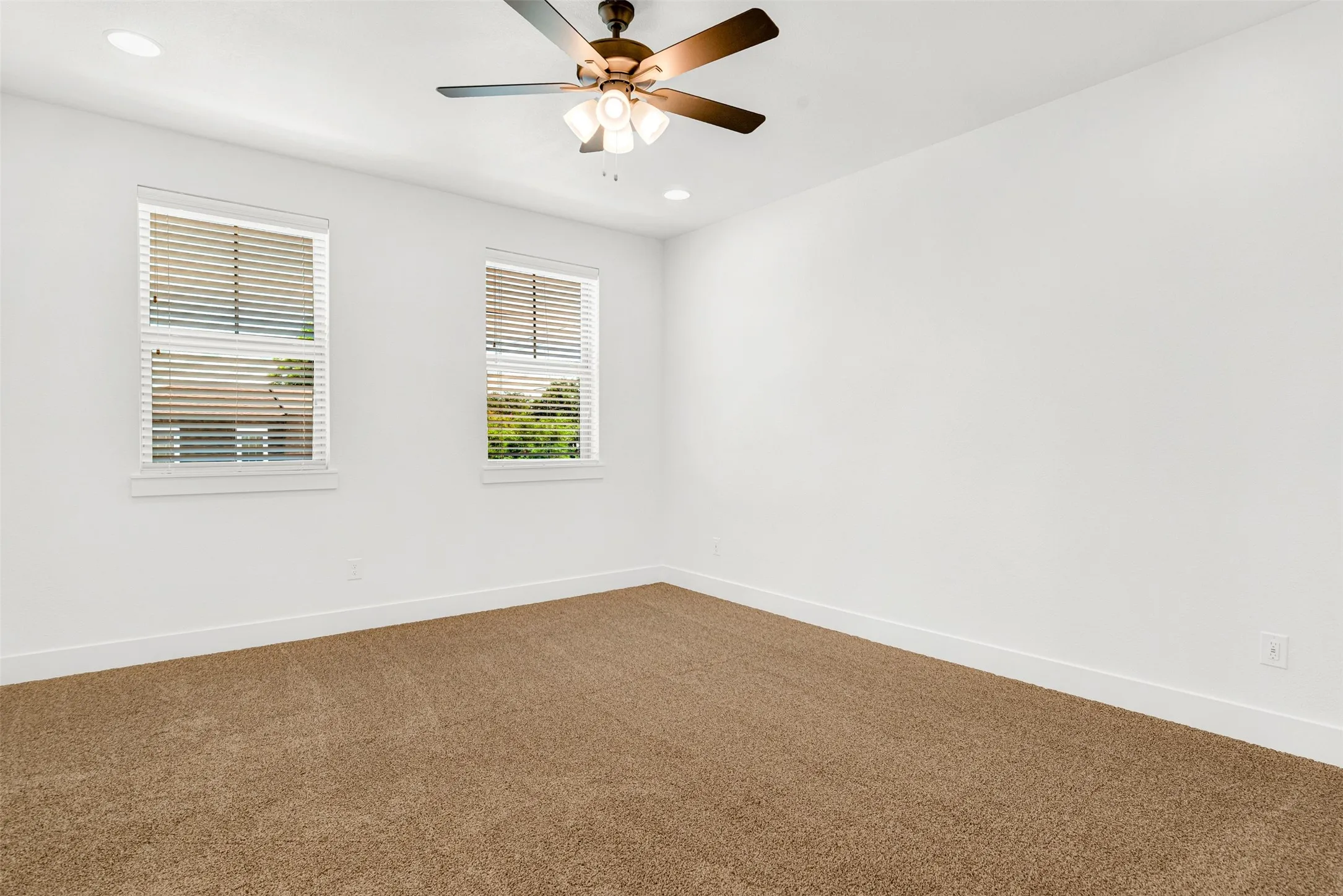Another view of upstairs secondary bedroom with lots of natural light.