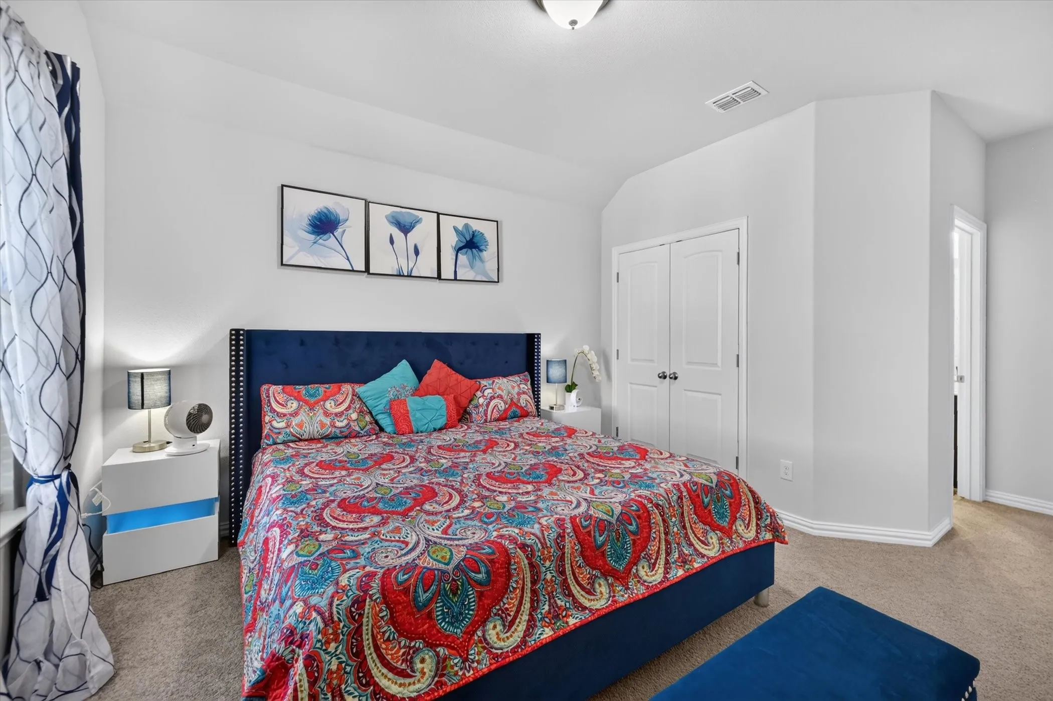 Carpeted flooring, white interior walls, white trim, recessed lighting, and a white interior door