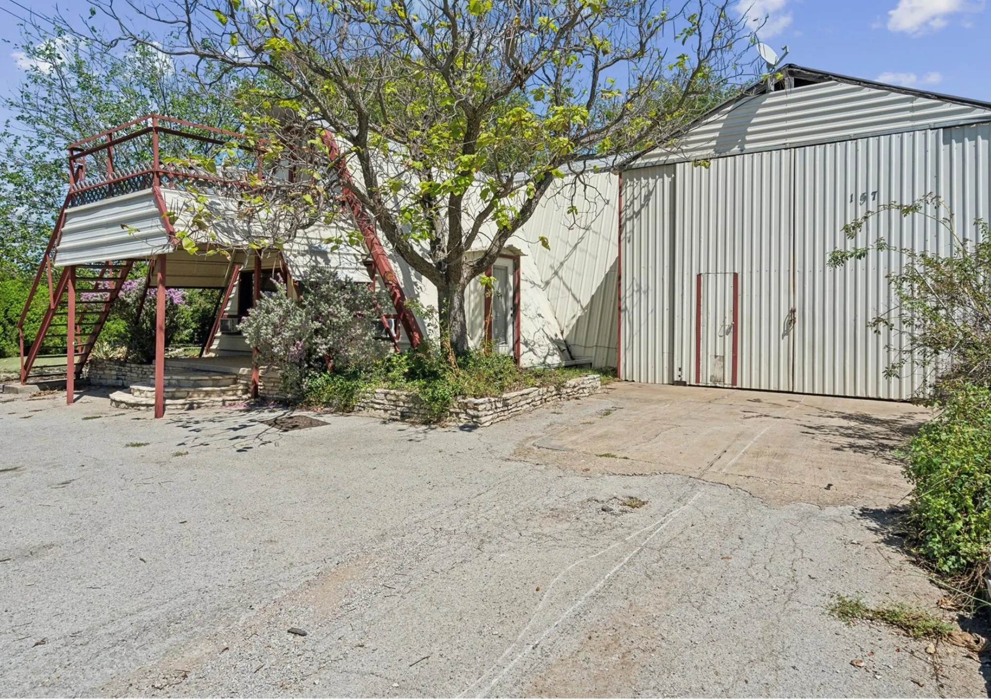 View of outbuilding featuring stairs