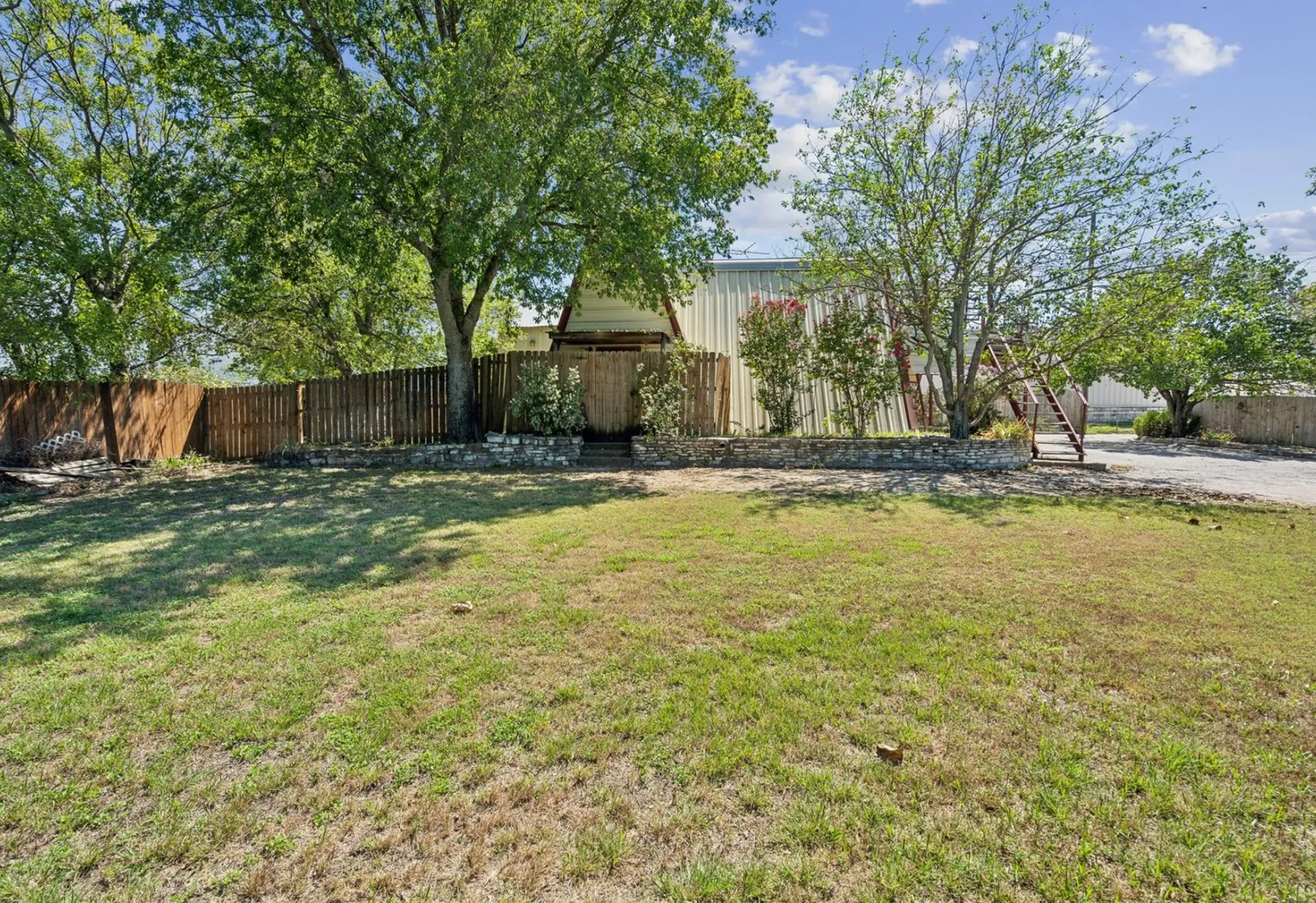 View of yard featuring fence