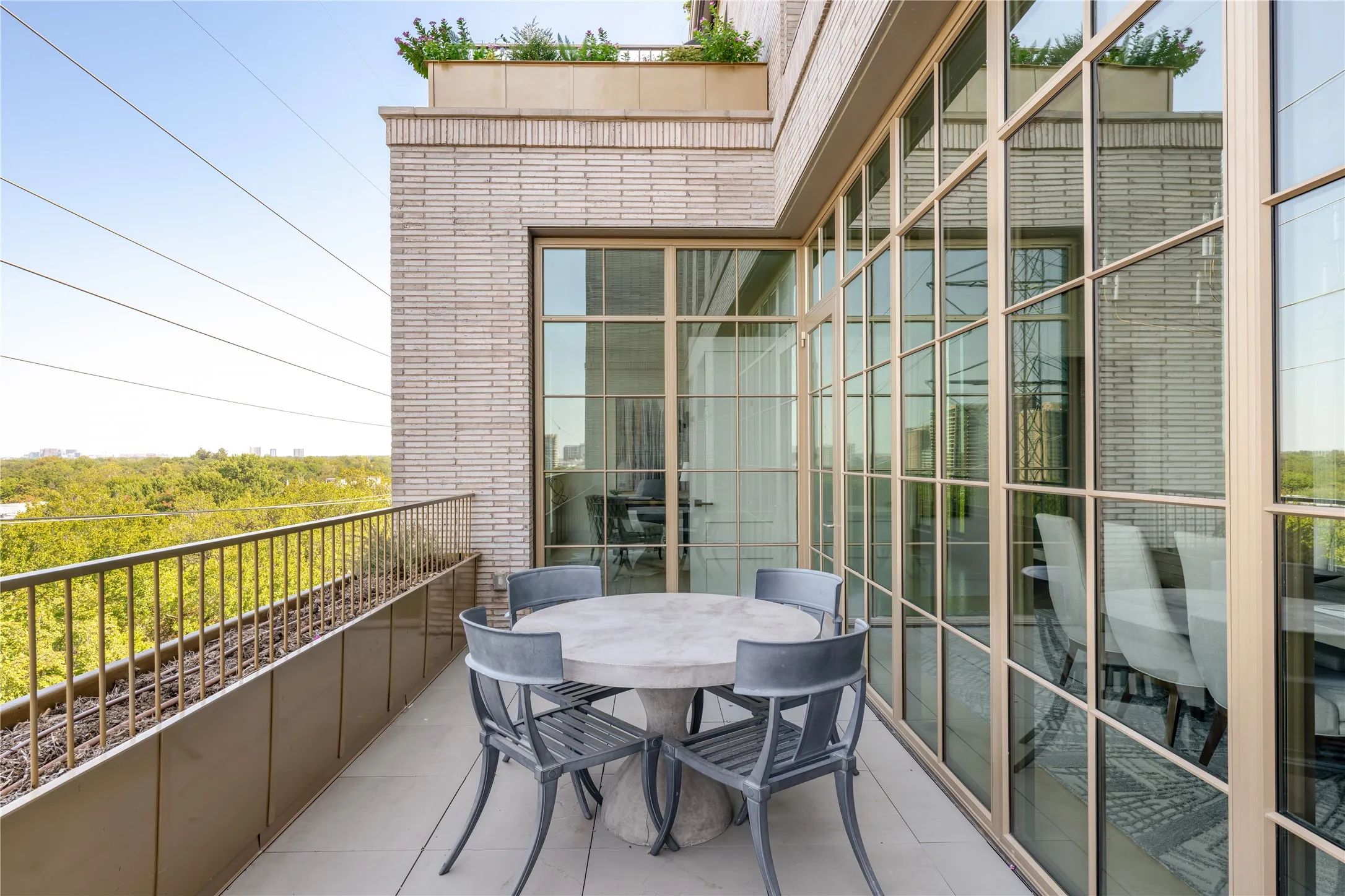 Expansive outdoor balcony with a light-toned tile surface