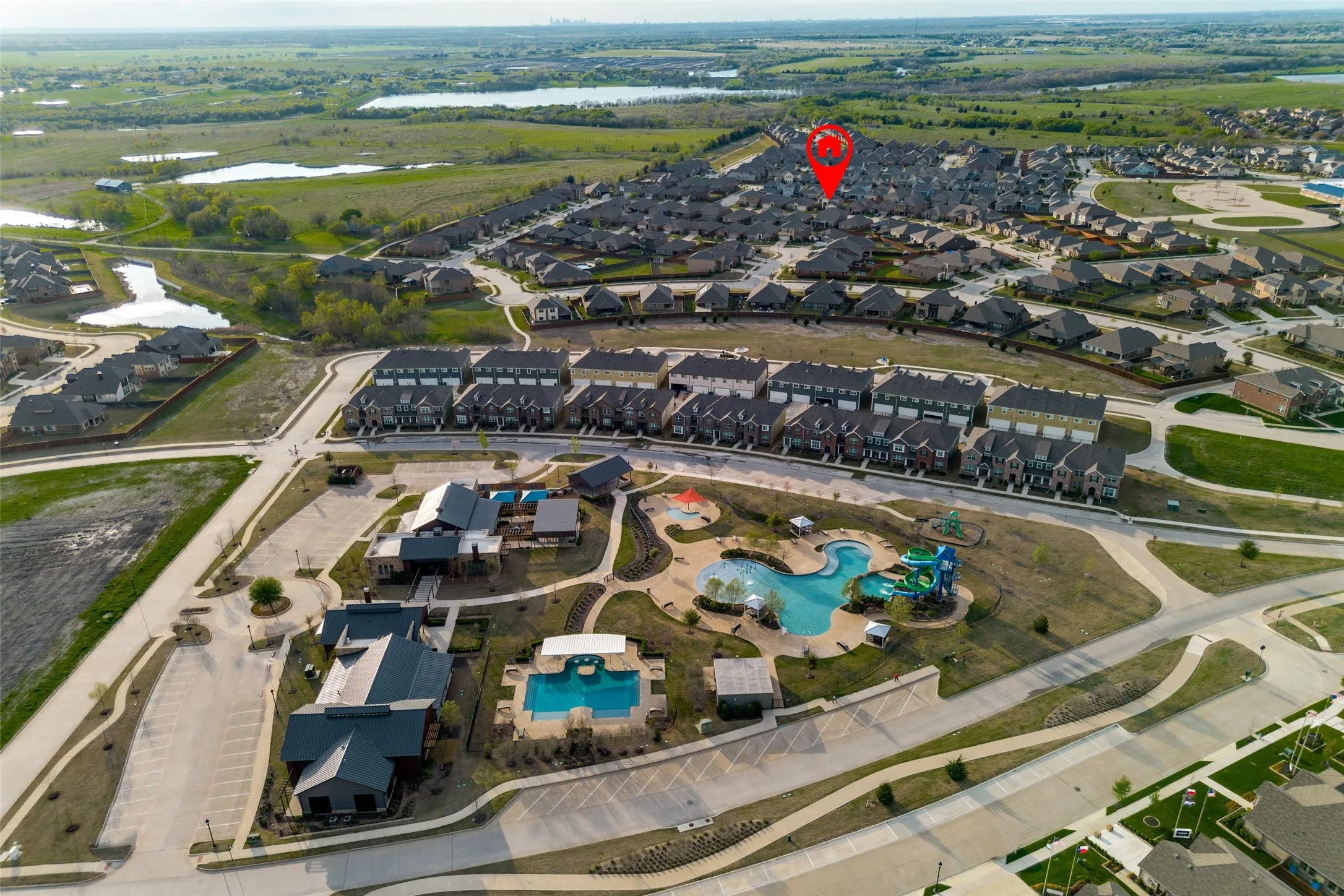 Community amenities including a swimming pool with water slides, a rectangular swimming pool, and multiple community buildings