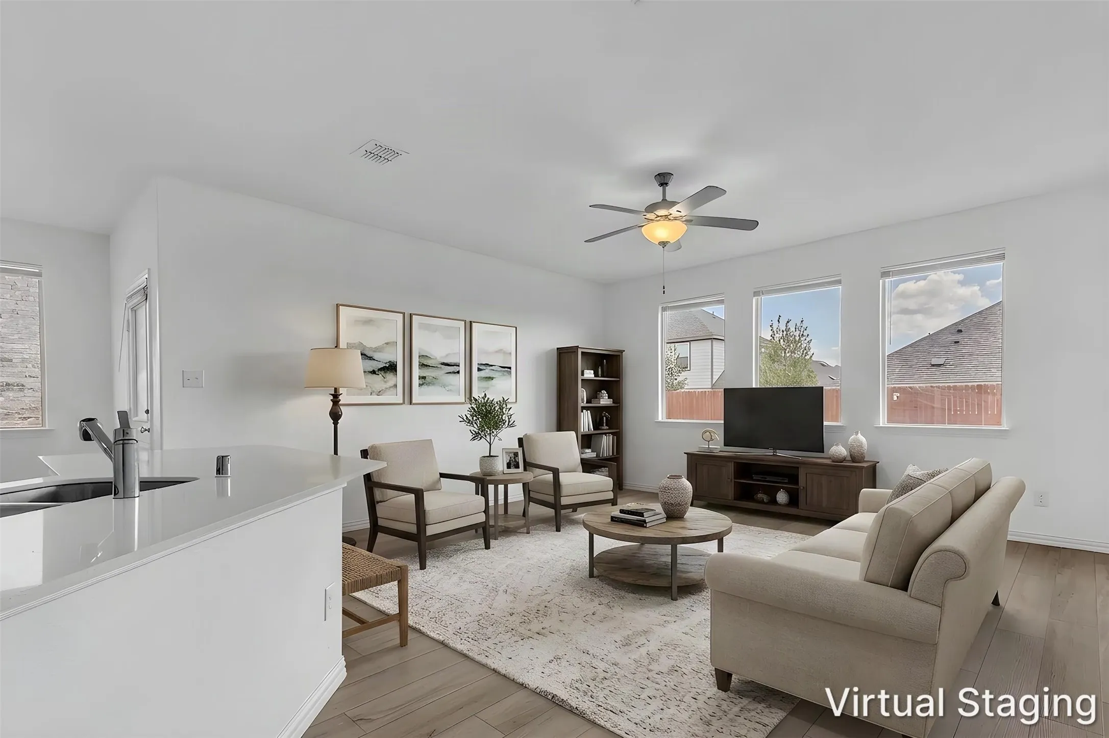 Virtually staged living room in this Walden Pond East home, with three windows and an open view to the kitchen