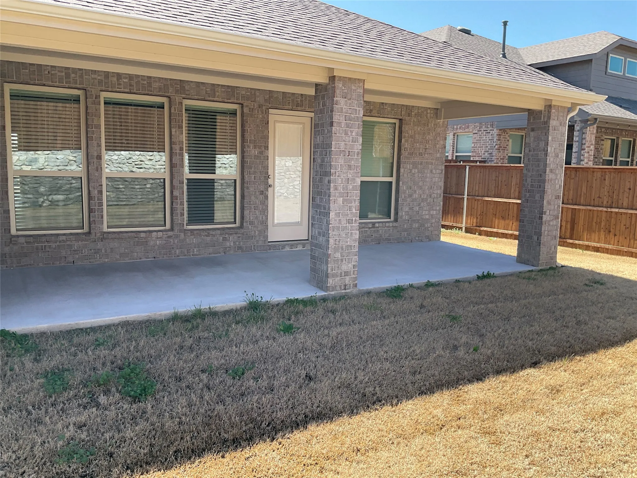 View of patio with fence
