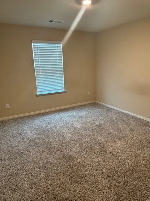 Recessed ceiling lighting, window with blinds, and carpeted flooring