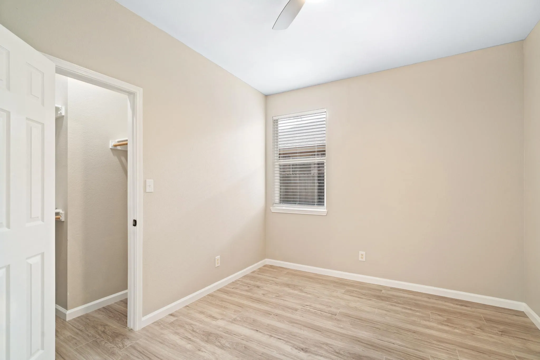The secondary bedrooms are generously sized and boast laminate flooring.