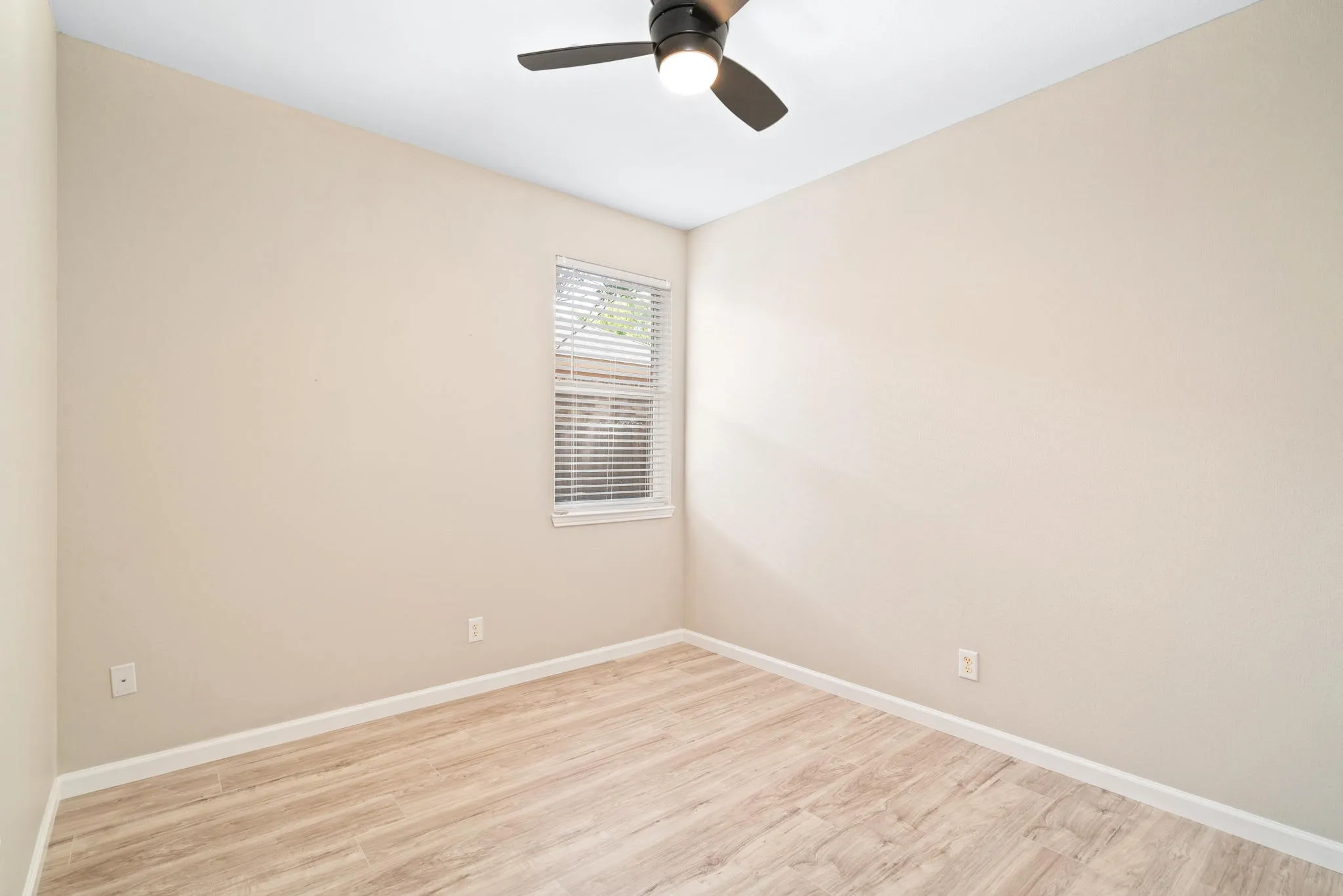 The secondary bedrooms are generously sized and boast laminate flooring.