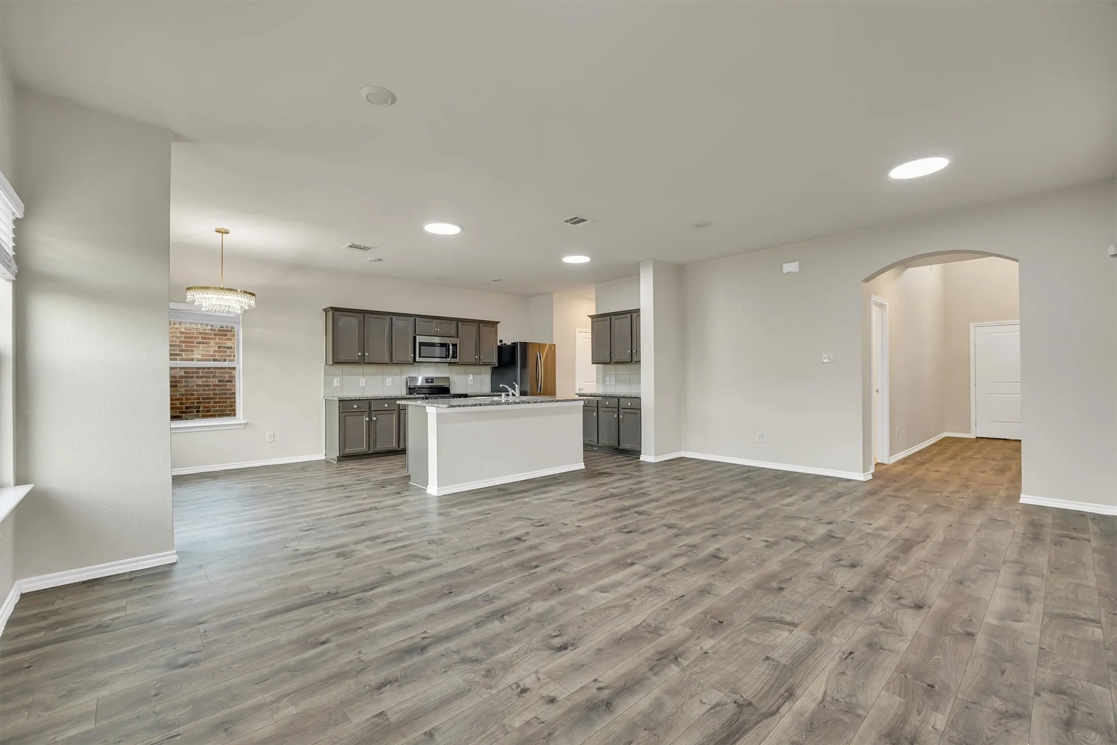 Open concept layout with wood-finish flooring