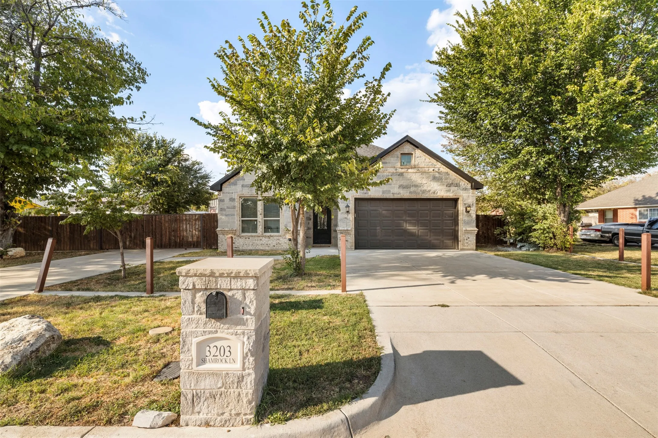 Stone exterior with a prominent front-facing garage