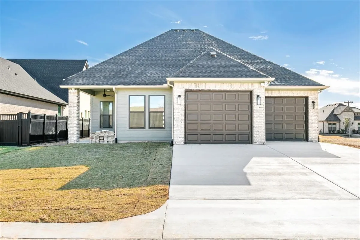 Rear view with garage entry; 10' garage doors