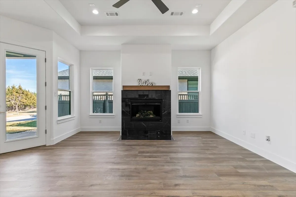 Elegant tile framed gas fireplace