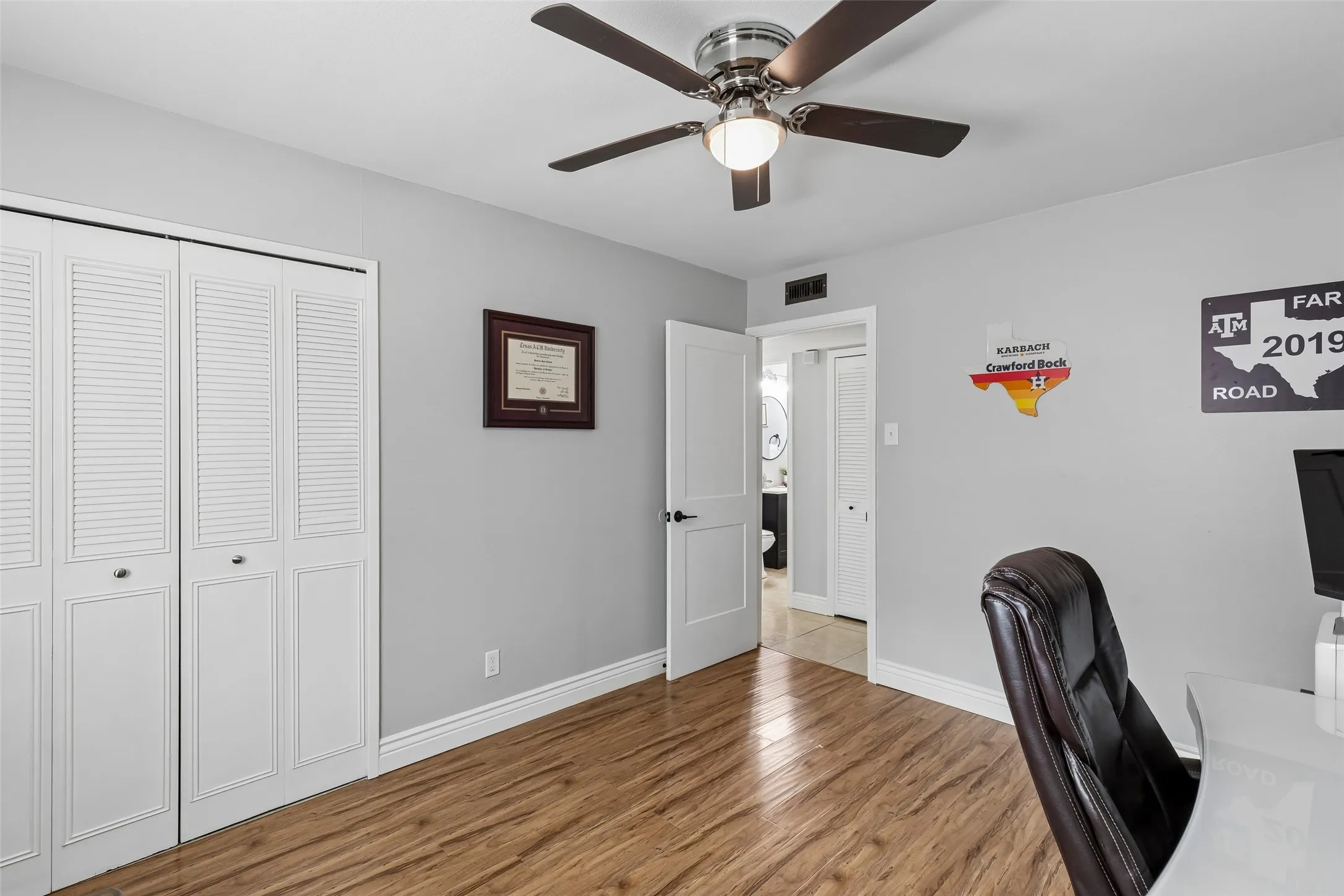 Positioned just off the hall bath, this flex room works equally well as an office, guest room, or study.