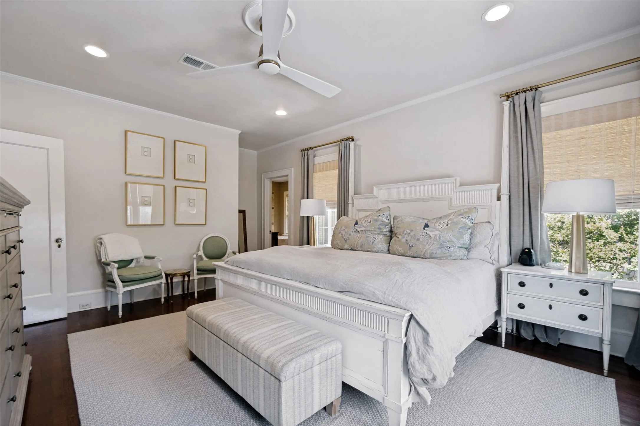 Recessed ceiling lighting, crown molding, a ceiling fan, and wood-finish flooring