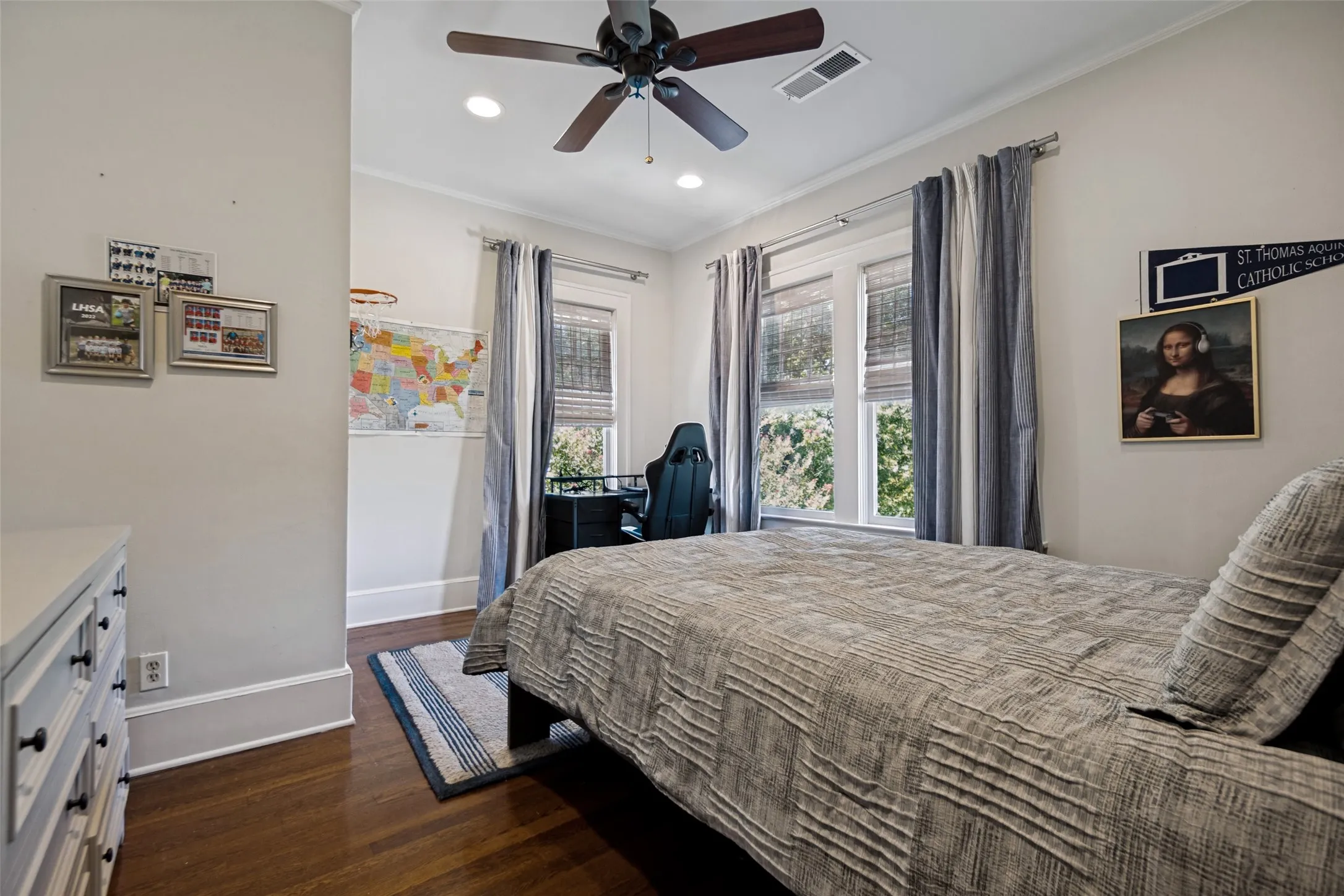 Hardwood flooring, recessed lighting, ceiling fan, and window treatments