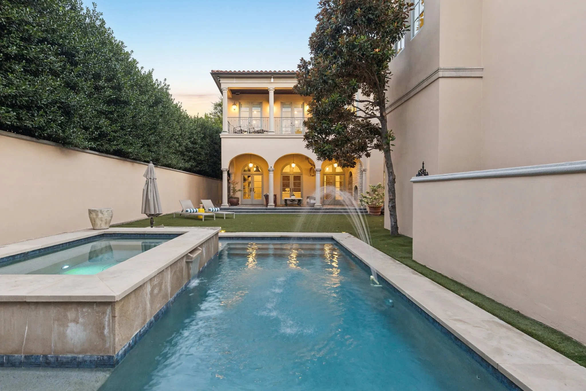 Pool and spa with water feature