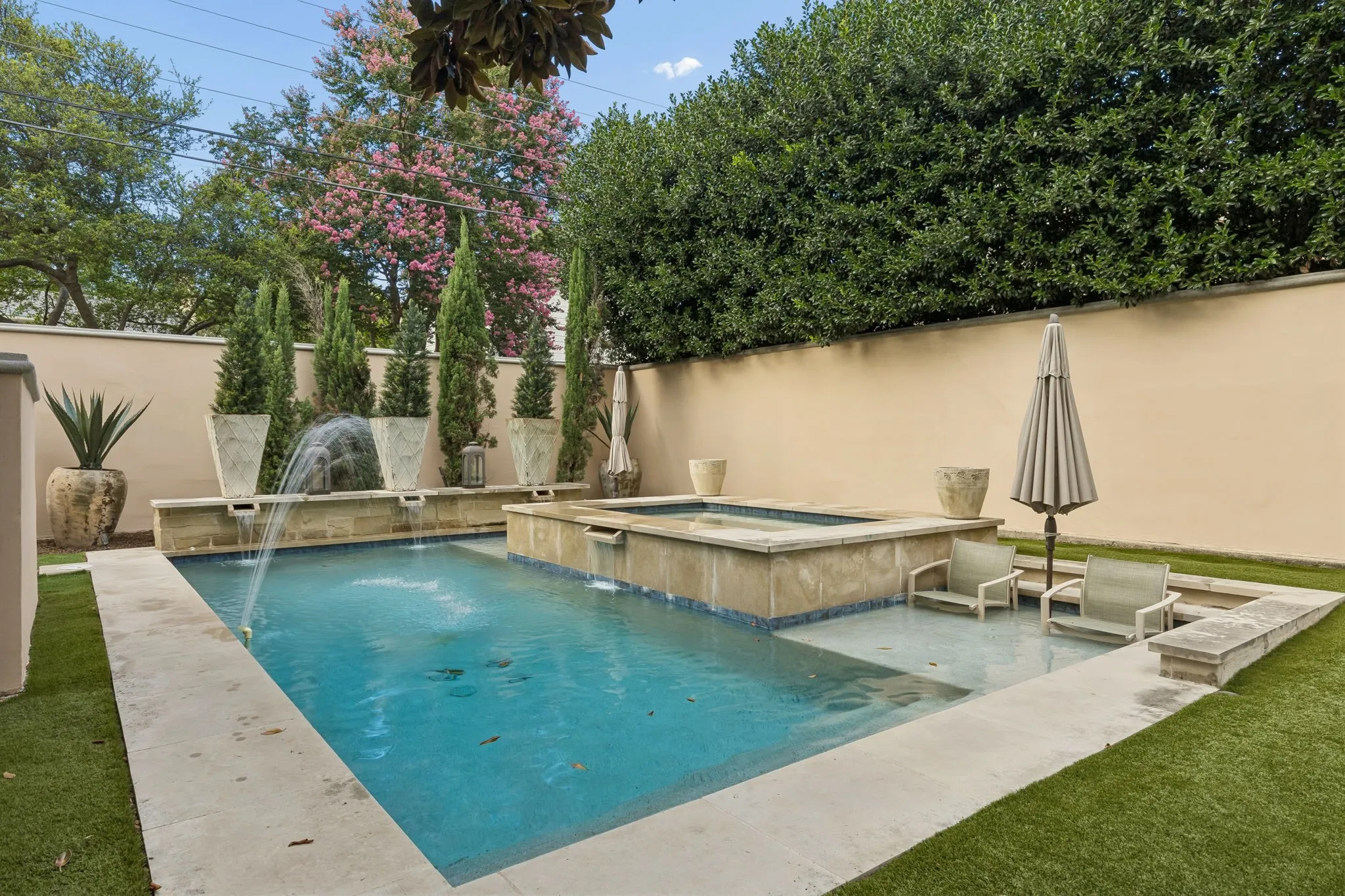 Pool and spa with water feature