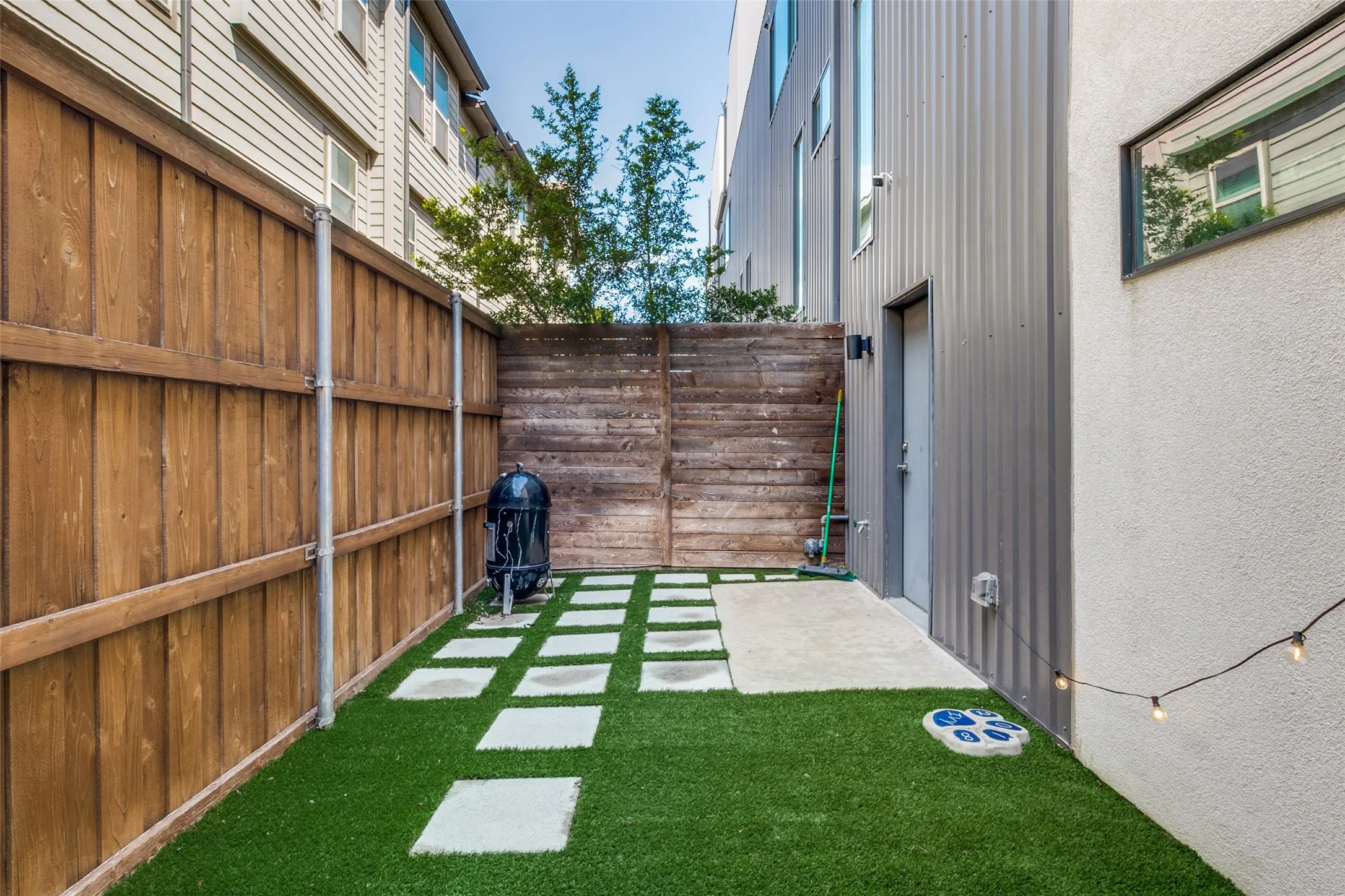 First floor yard, with Pergola, grilling and seating area