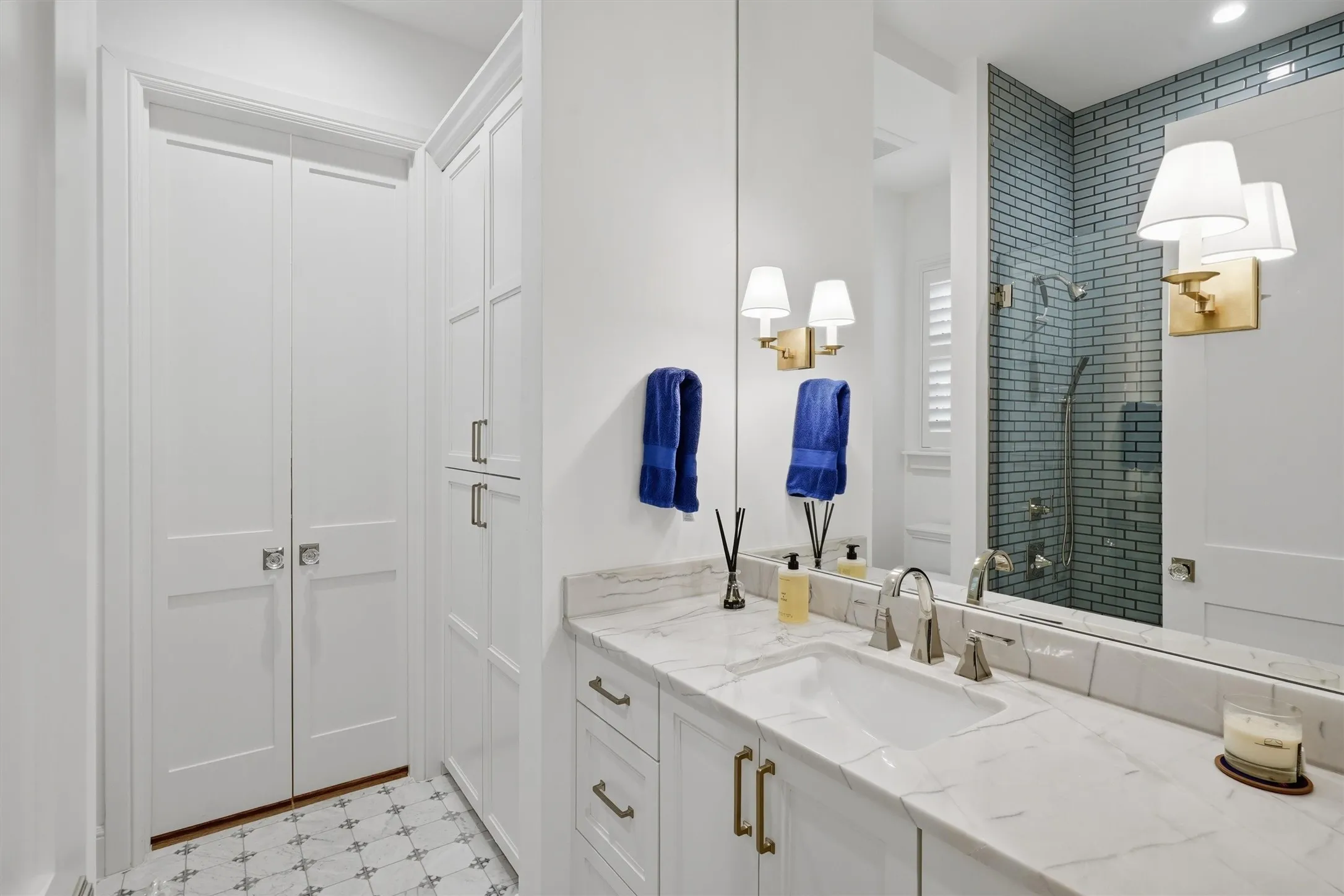 Bathroom with heated floors, walk in shower and custom closet.