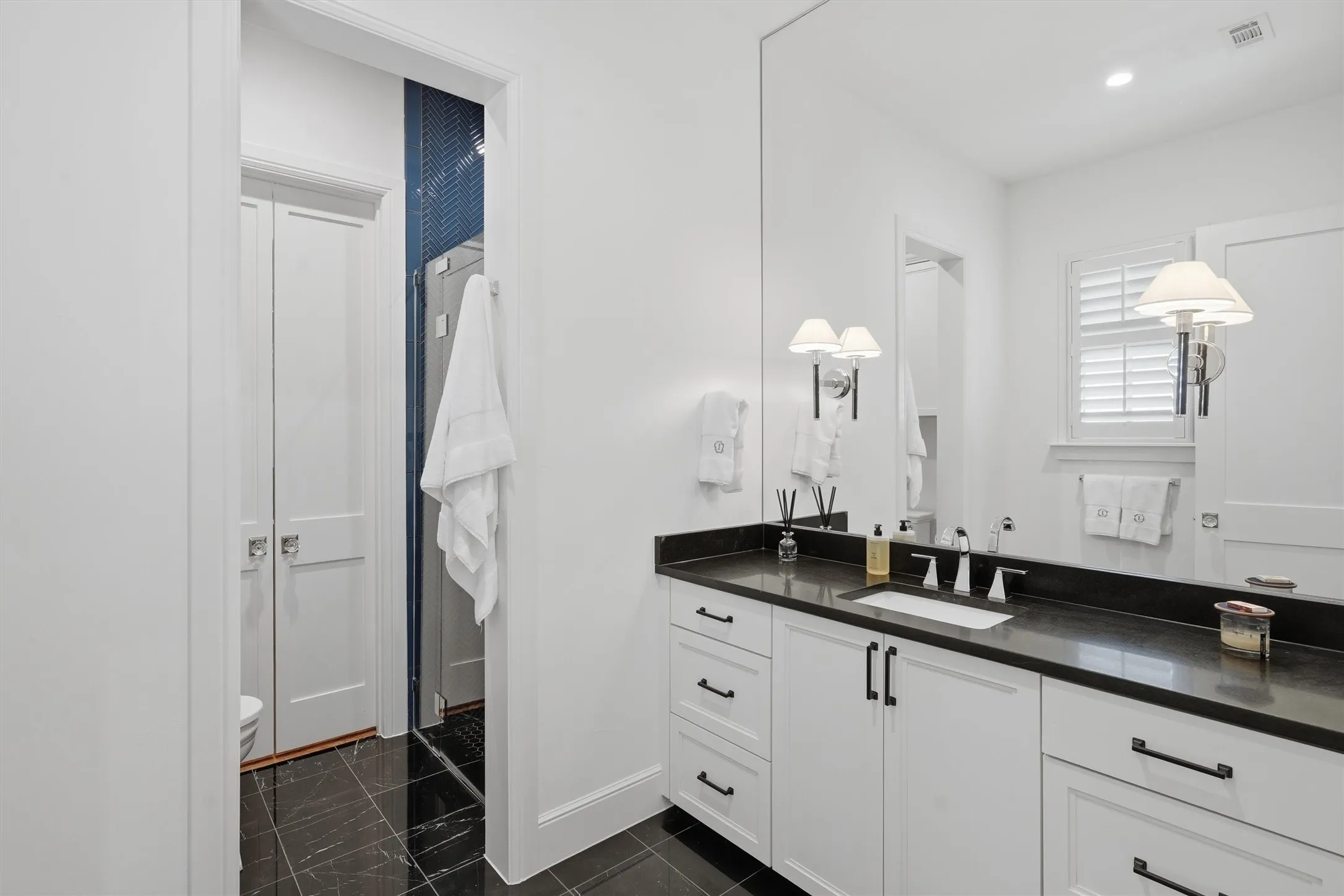 Bathroom with heated floors, walk in shower and custom closet.