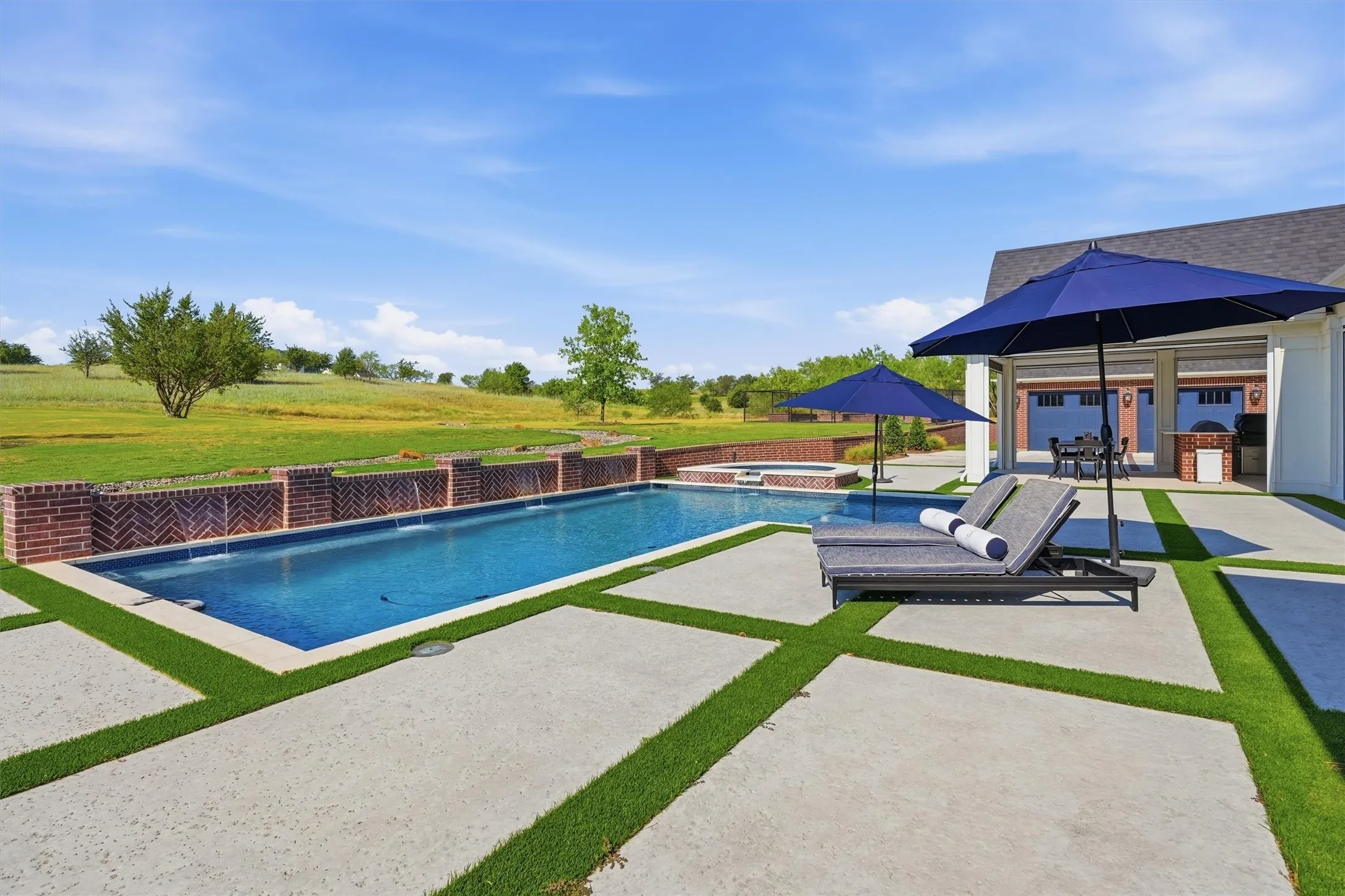 The pool overlooks the garden and it all easily connects to the outdoor living making it great for relaxing and enertaining.