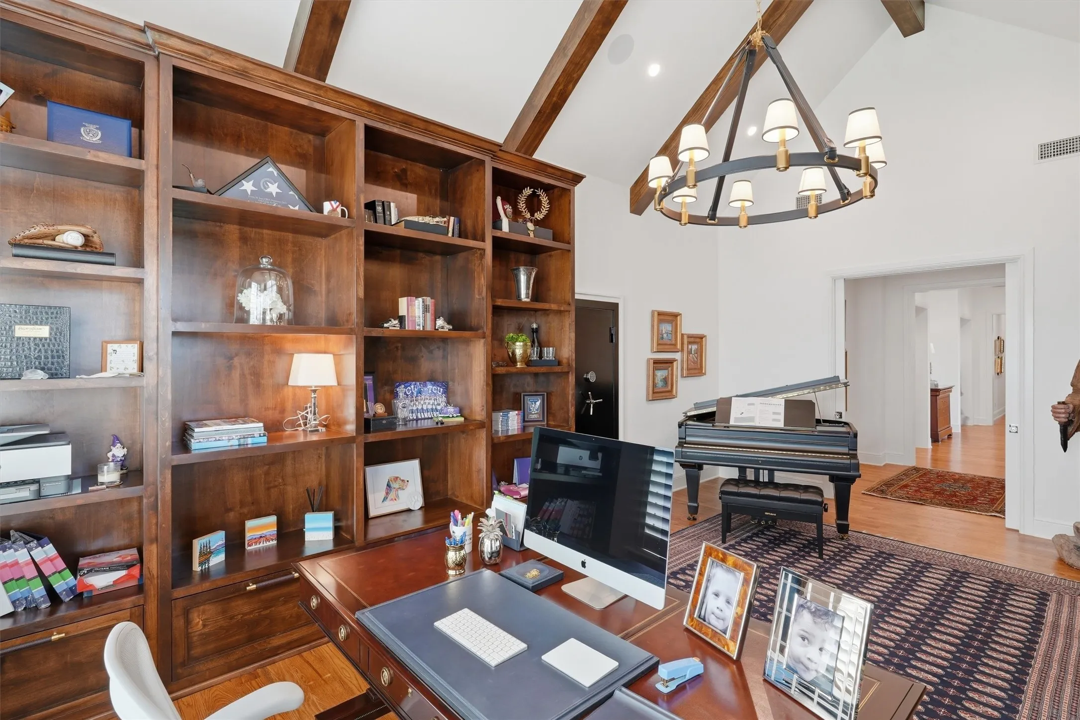The study offers warm wood beams, floor to ceiling built ins, and a built in tornado shelter.
