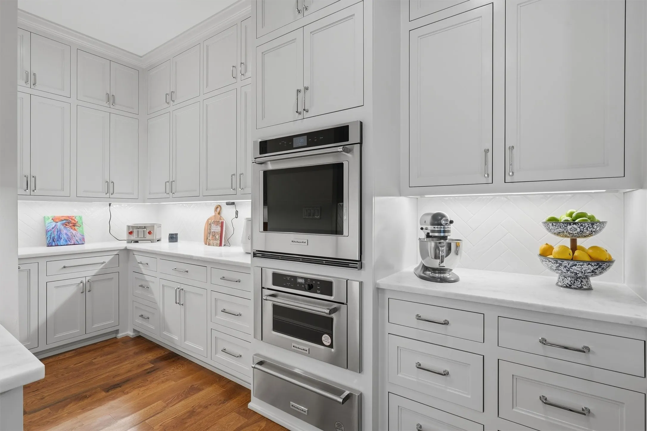 There is plenty of counter space making it easy to prep or entertain. There is a third oven, microwave, and warmer.
