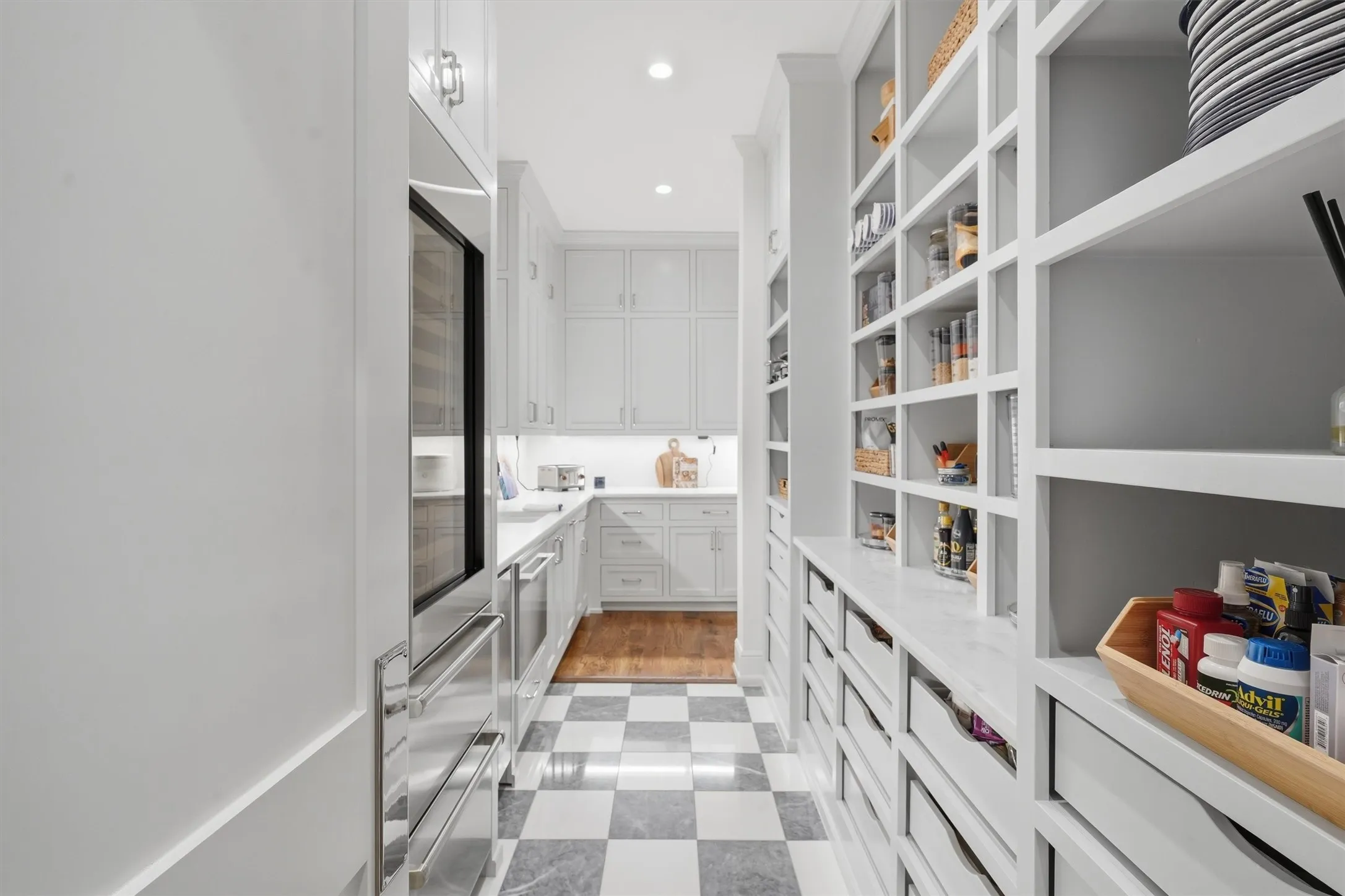 The Butlers Pantry has a built in wine fridge, nugget ice maker, and plenty of storage.