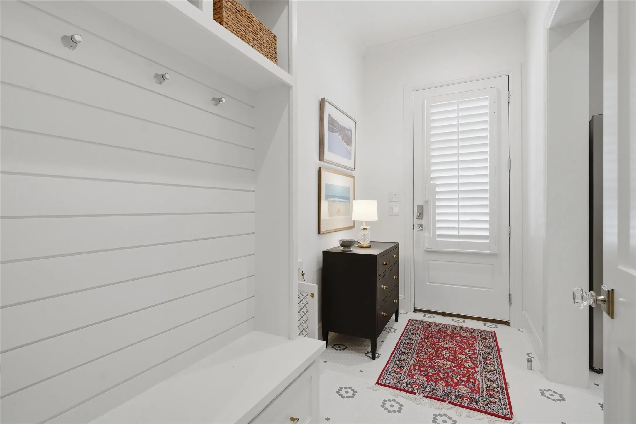 Side Entrance from the garage leads into the laundry room. There is a built in Mud Bench as you enter.